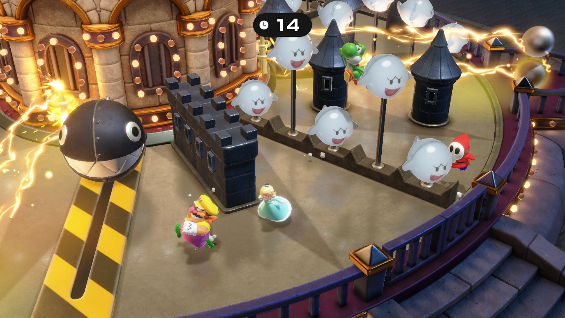 Una scena di Mario Party con personaggi e fantasmi su una piattaforma circolare con un cannone nero.