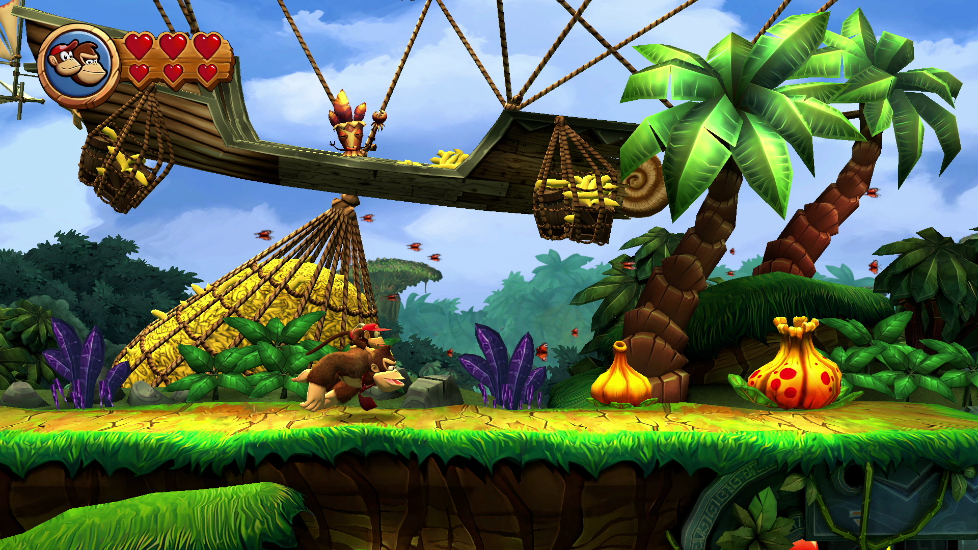 Donkey Kong Spielszene. Donkey Kong rennt auf einer grünen Plattform mit Bananen.