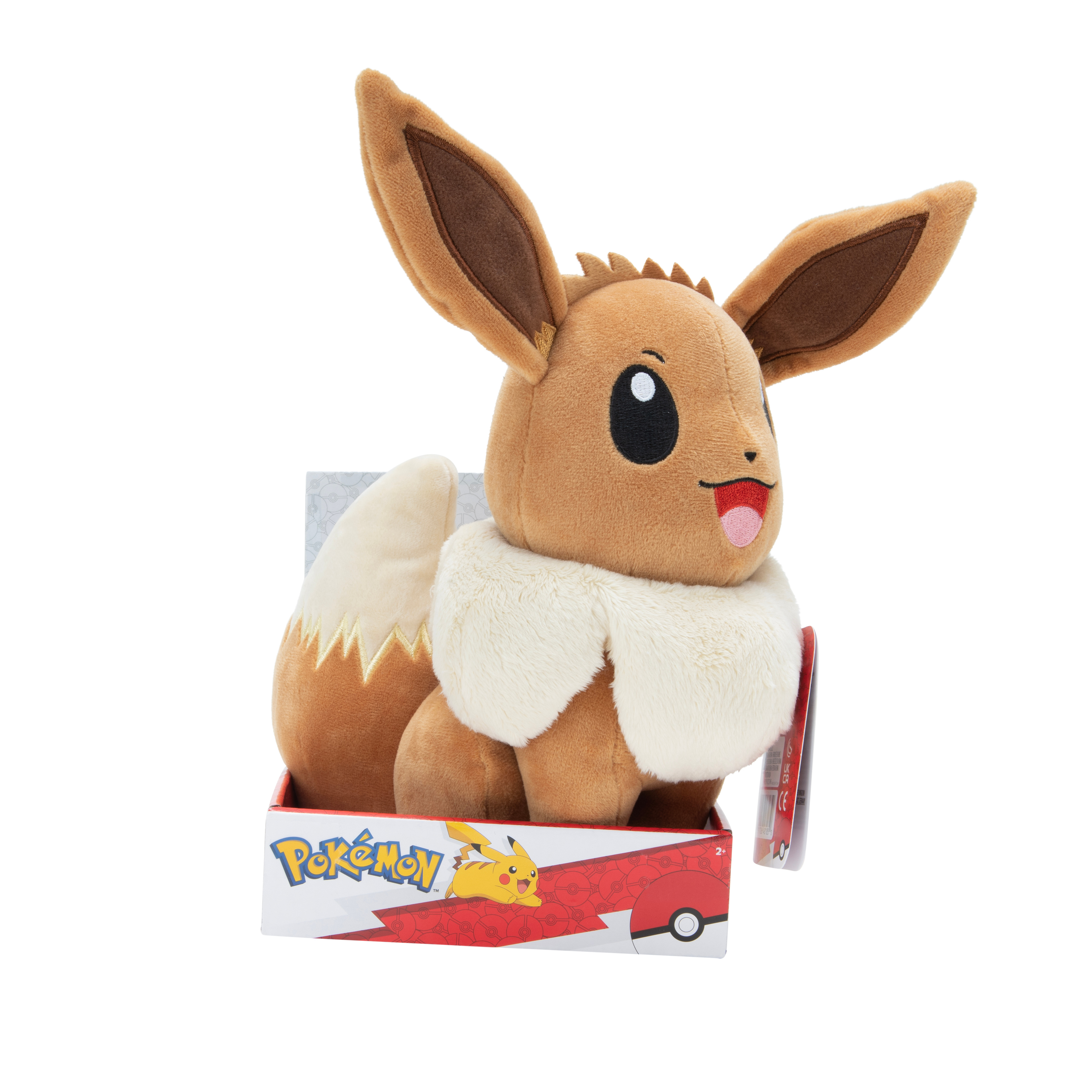 Eevee Plüschtier in einer Box. Hellbraun und weiß mit rosa Zunge.
