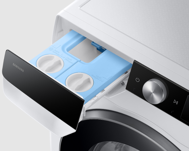 Szuflada na detergent pralki, otwarta, pokazująca dwie przegrody.