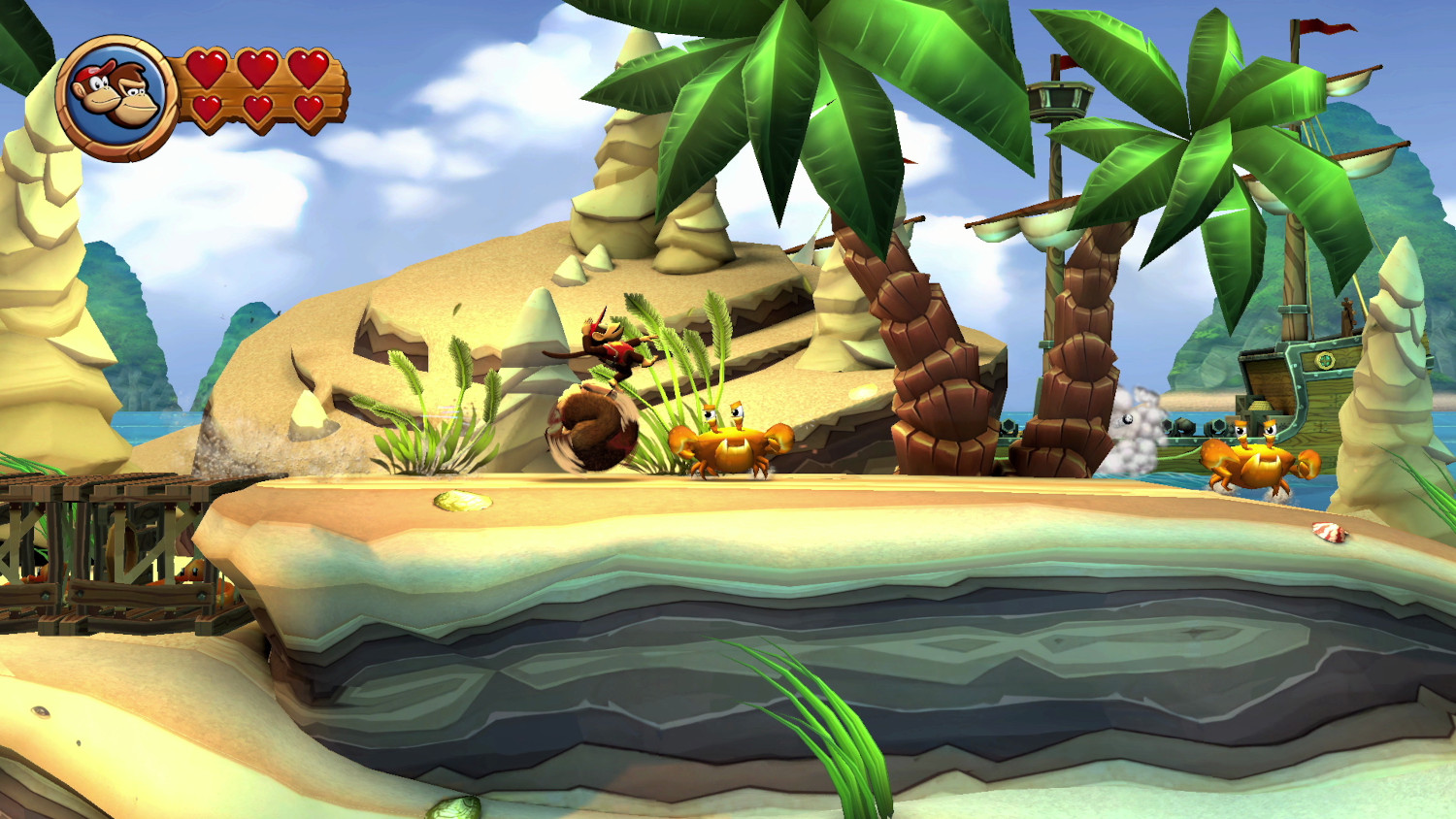 Donkey Kong game scene: Donkey Kong springt, krabben, palmbomen en een piratenschip.