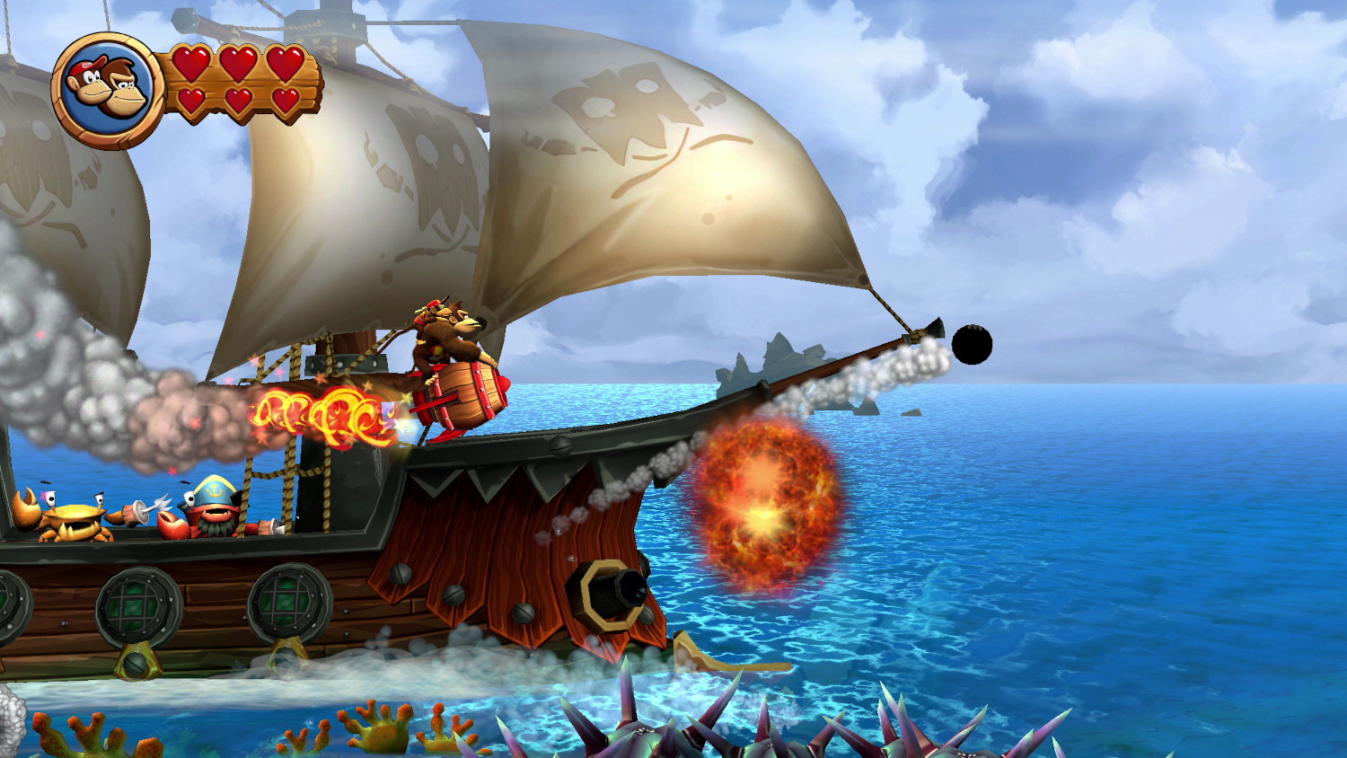 Een Donkey Kong-game-scène met een piratenschip dat op een explosie in het water schiet. Krabben en een personage zijn zichtbaar.