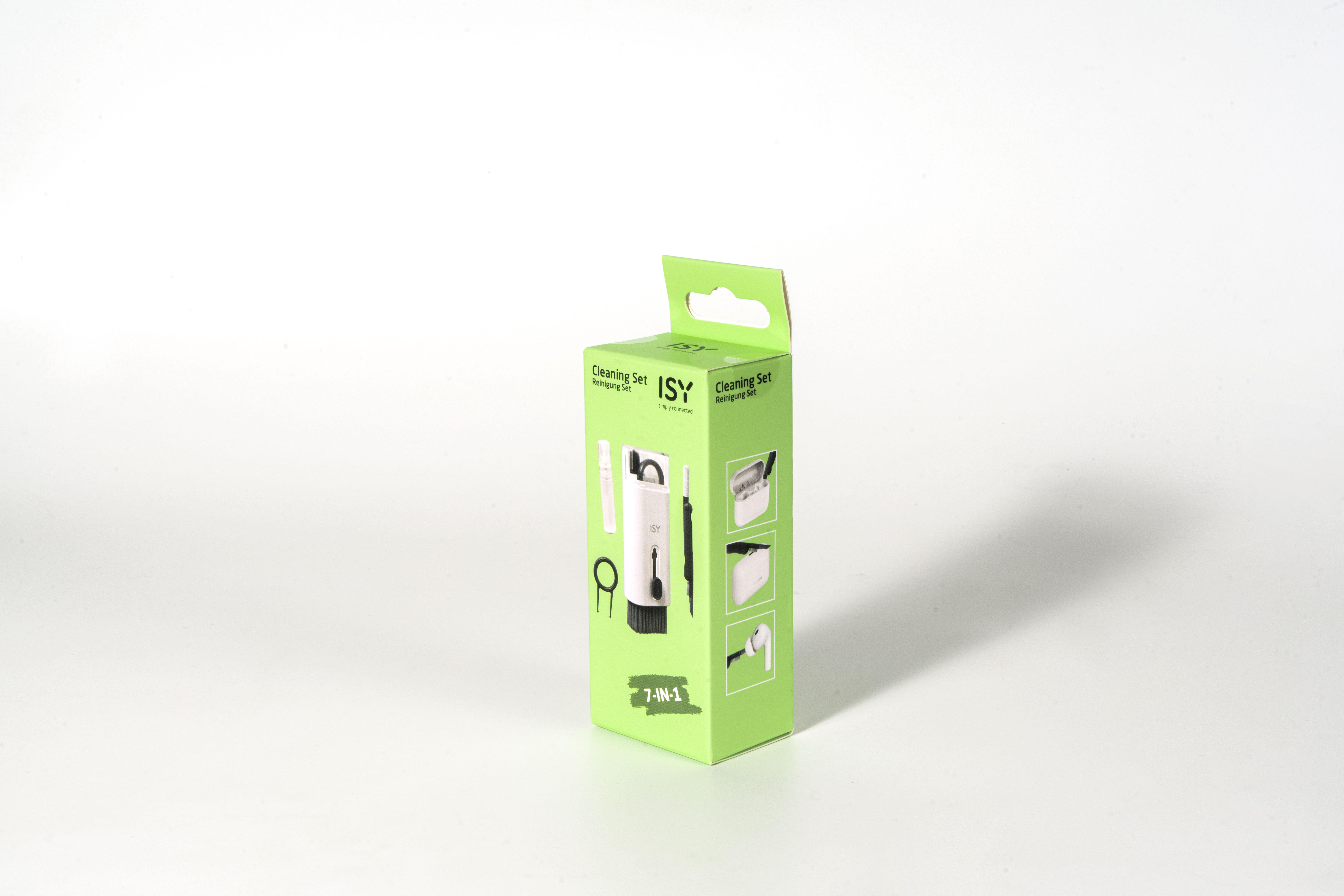 Grüne und weiße Box mit einem Reinigungsset, Bildern von Komponenten und einem Ohrhörer.