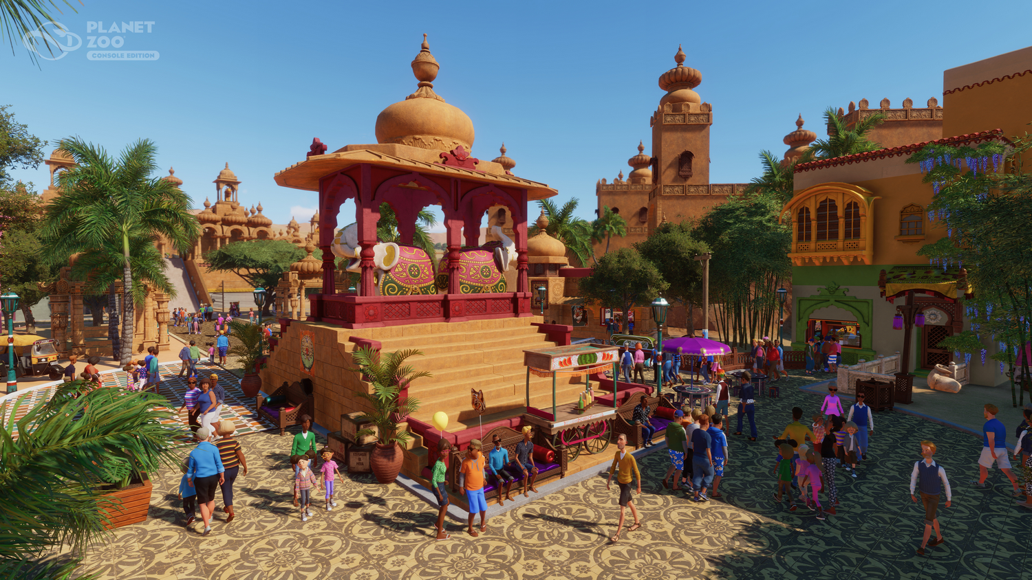 Escena de Planet Zoo con tema indio. Muchas personas, edificios y estatuas de elefantes son visibles.