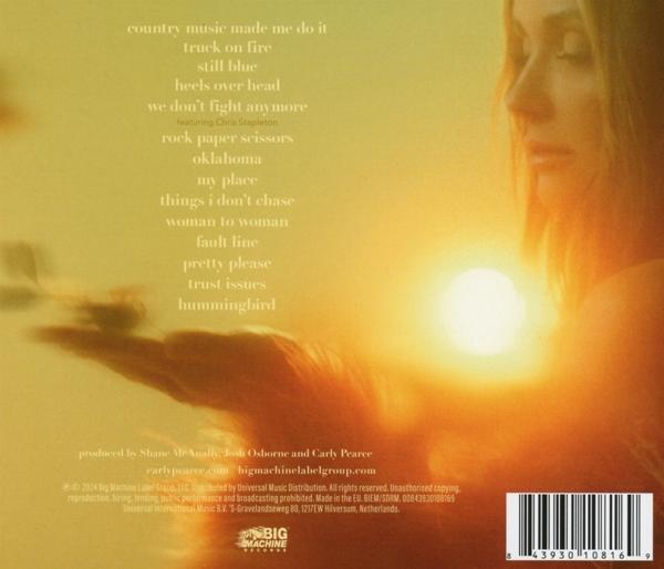 Rückseite eines CD-Covers mit Songtiteln und dem Gesicht einer Frau. Sonne im Hintergrund mit Text.