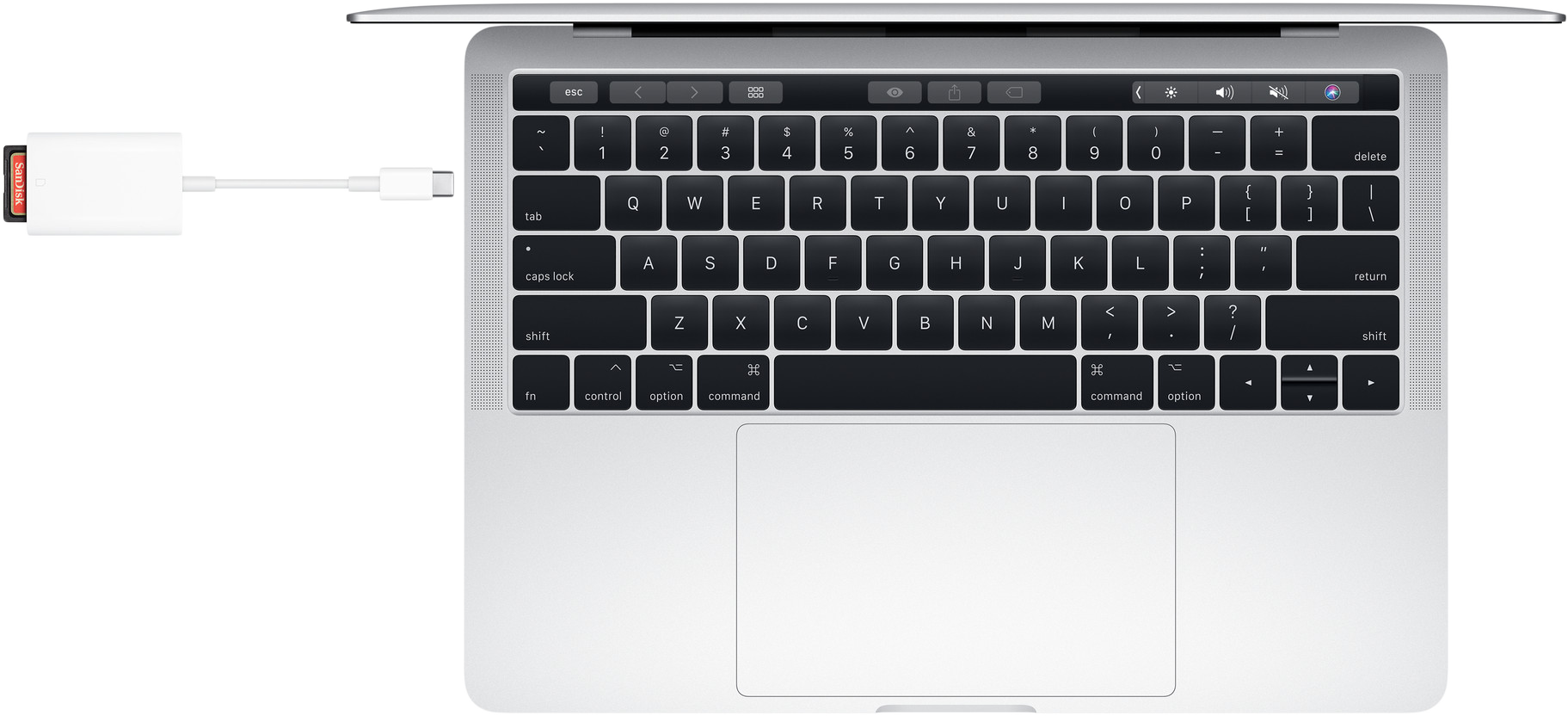Laptop-Tastatur mit weißem Adapter und eingesetzter roter SD-Karte, auf schwarzem Hintergrund.