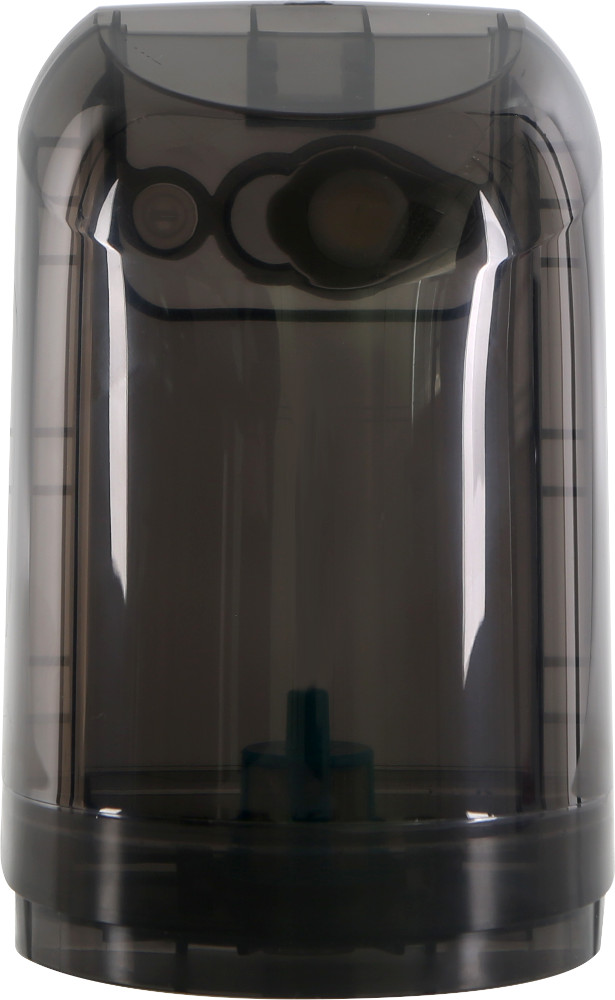 Transparent, dark container with a dark green cap. Inside is a dark green piece.