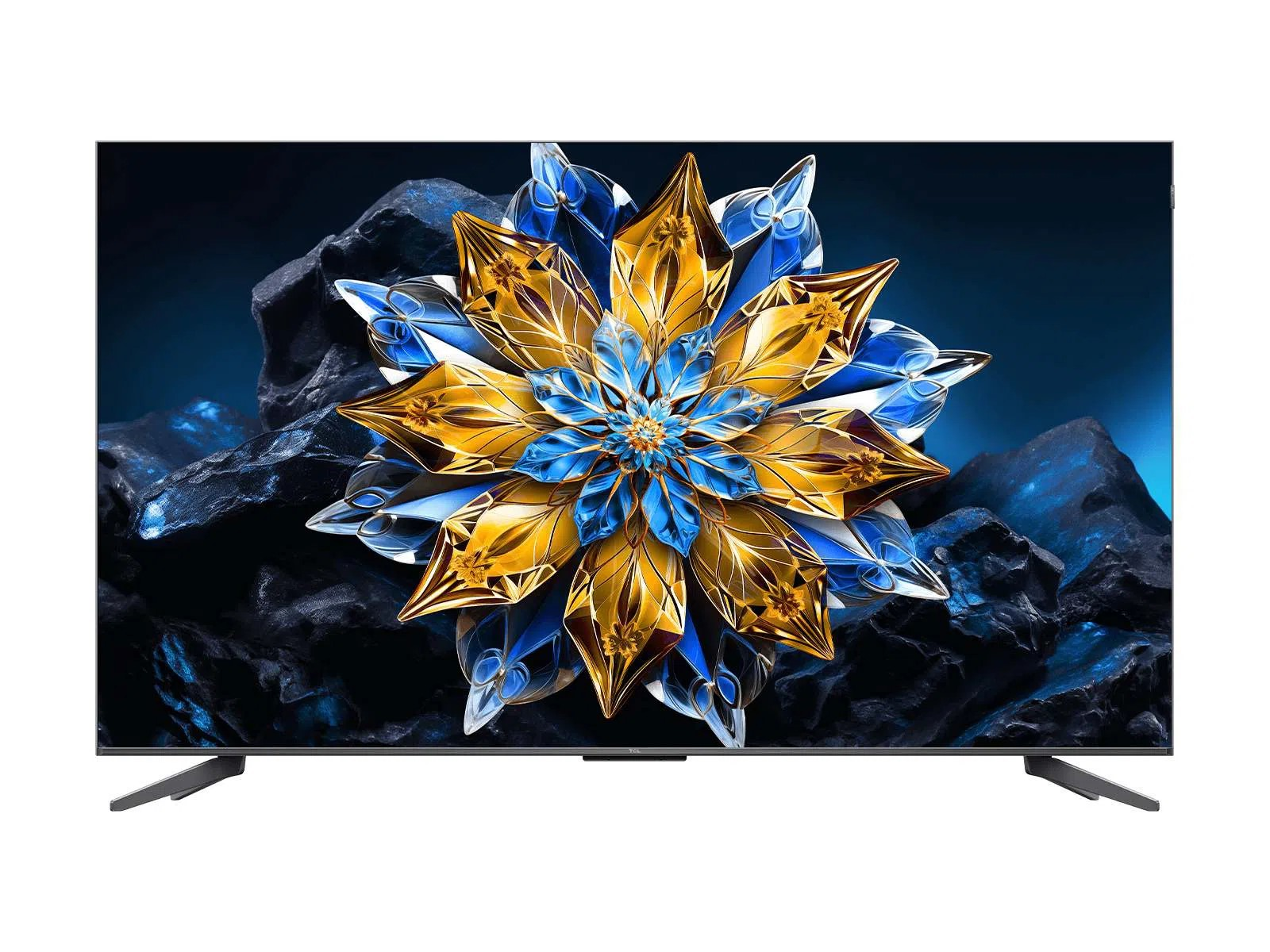 Siyah taş zemin üzerinde renkli dijital çiçek tasarımı gösteren geniş ekranlı TV.