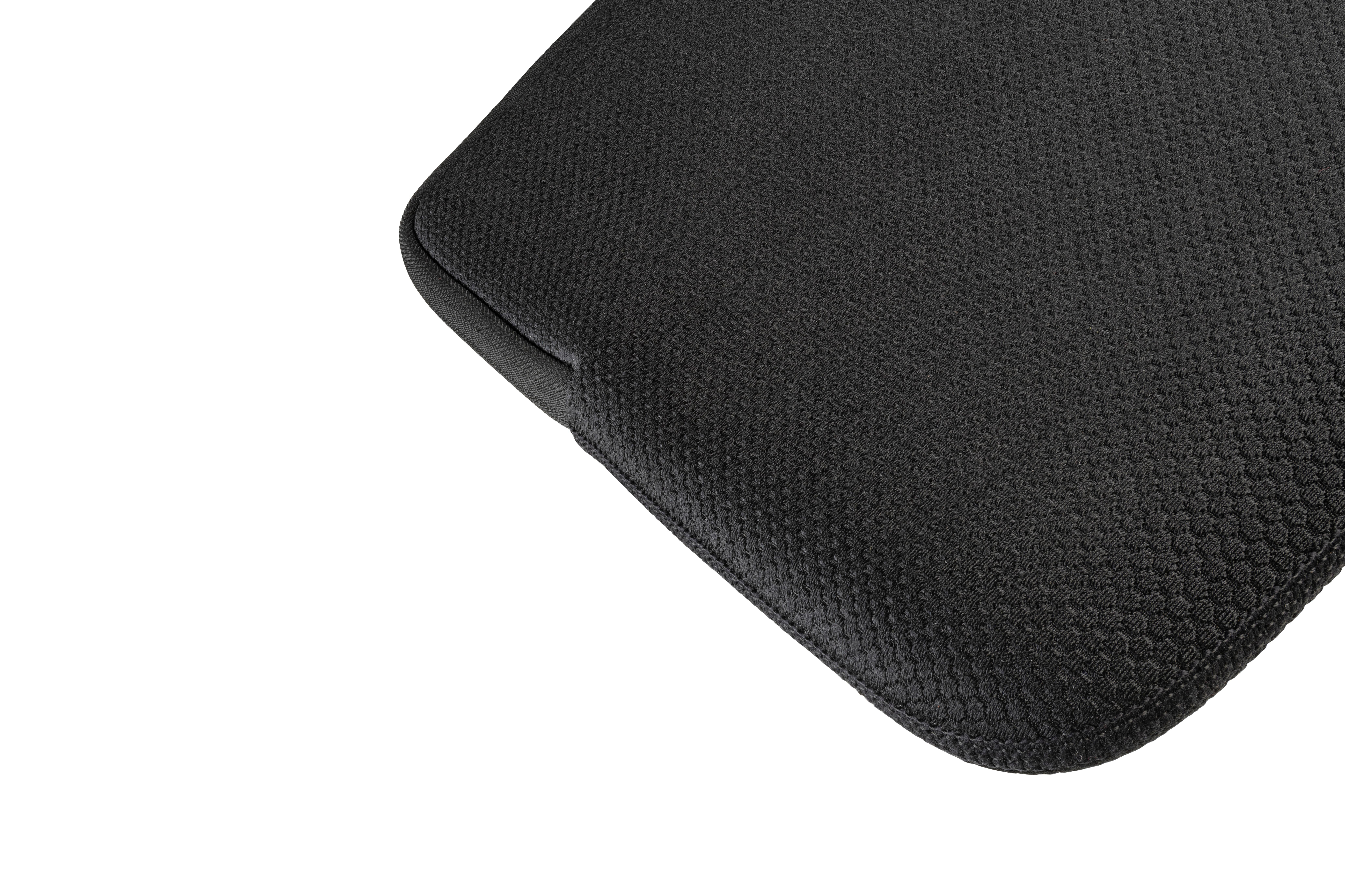 Nahaufnahme einer schwarzen, strukturierten Oberfläche, möglicherweise eine Laptop-Hülle.