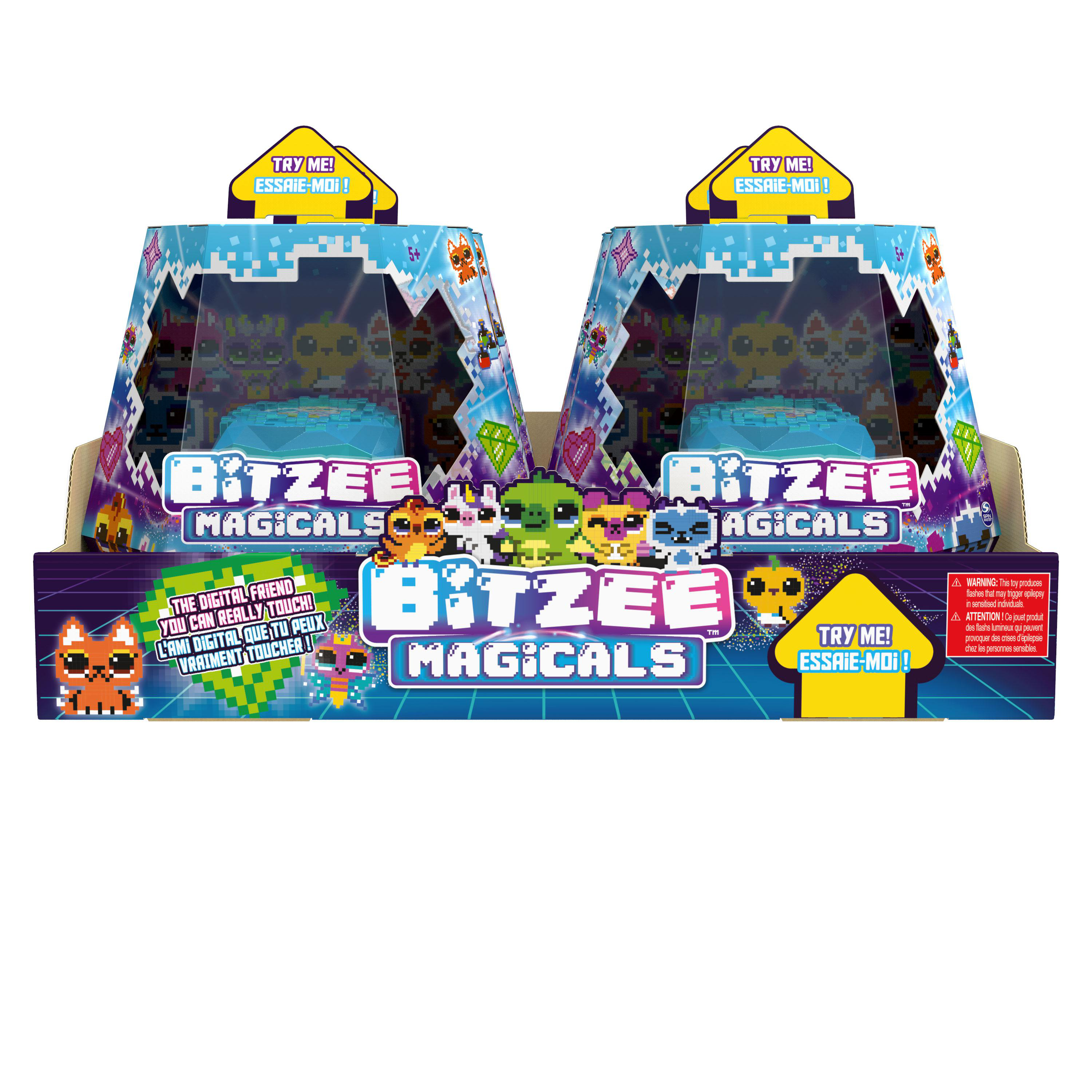 Zwei Spielzeugboxen von Bitzee Magicals, mit Figuren und Text, auf weißem Hintergrund.