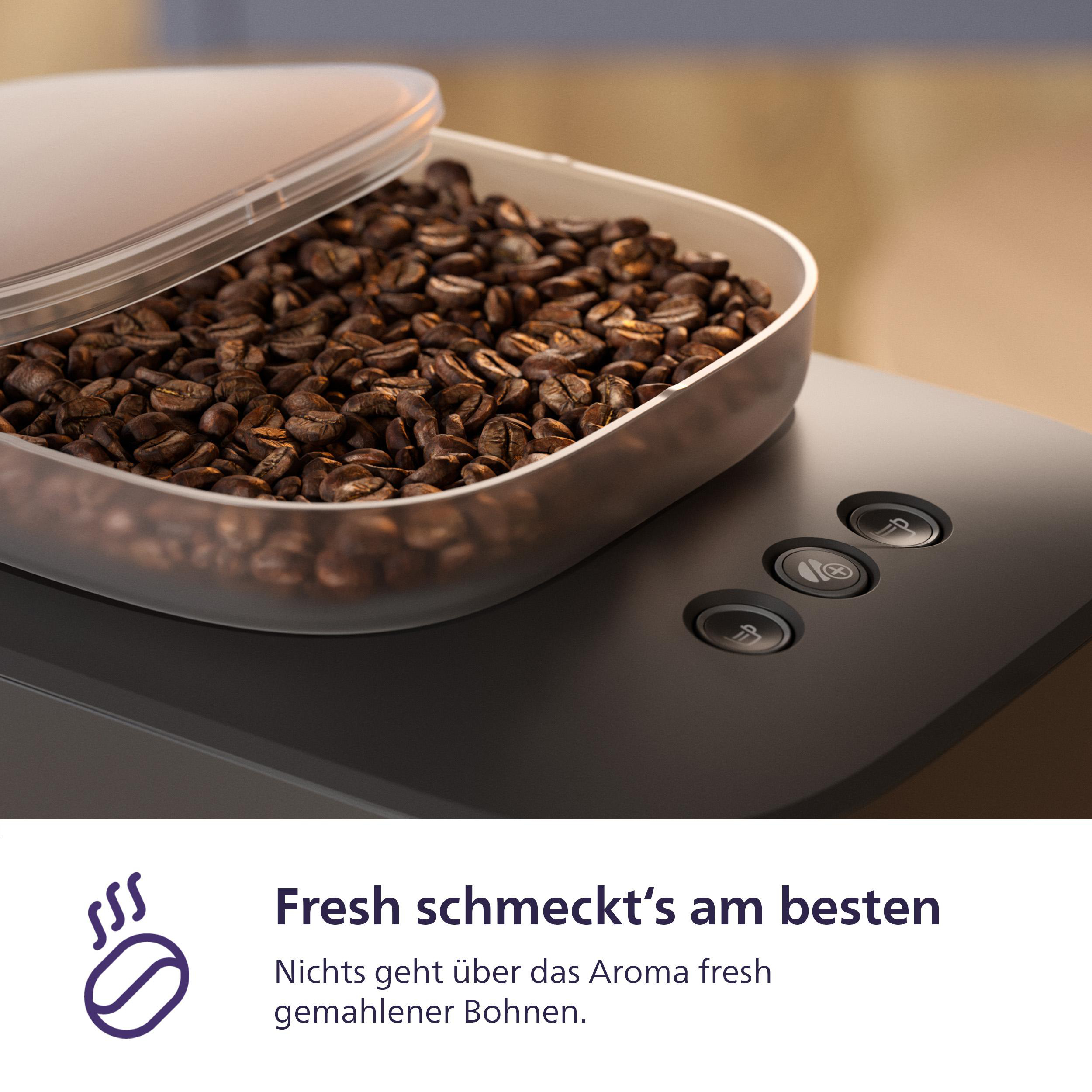 Kaffeebohnen in einem transparenten Behälter auf einer Kaffeemaschine, mit Text.