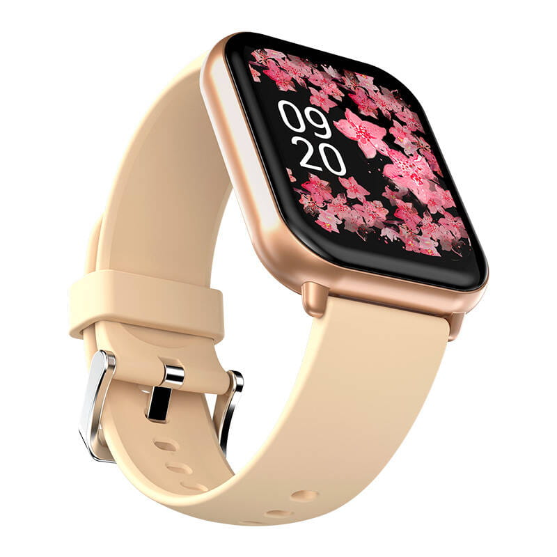 Smartwatch ze złotą obudową i jasnobeżowym paskiem, wyświetlający kwiatowy wzór.