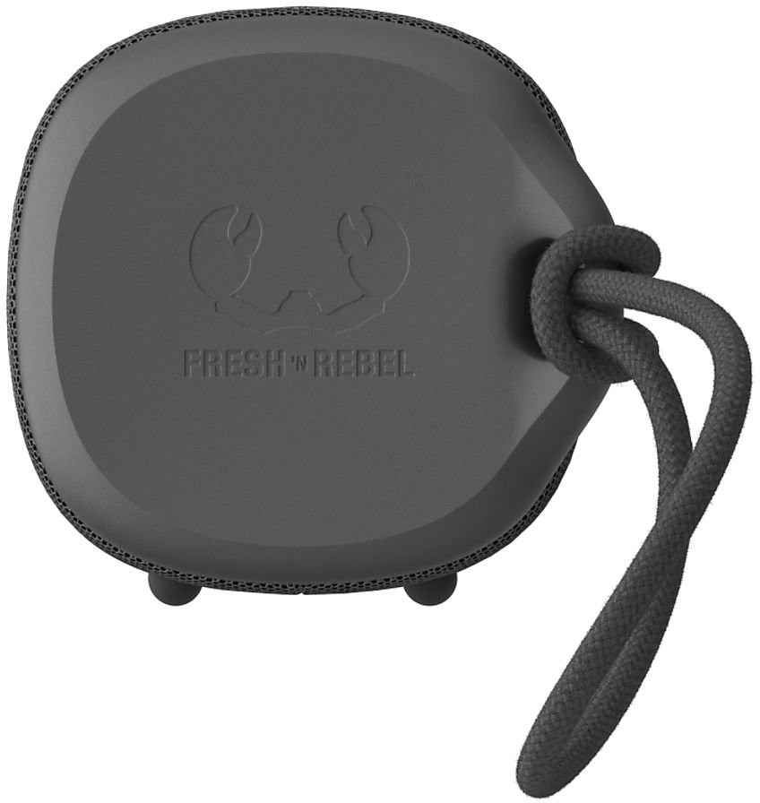 A dark grey Fresh 'n Rebel speaker with a rope handle on a white surface.