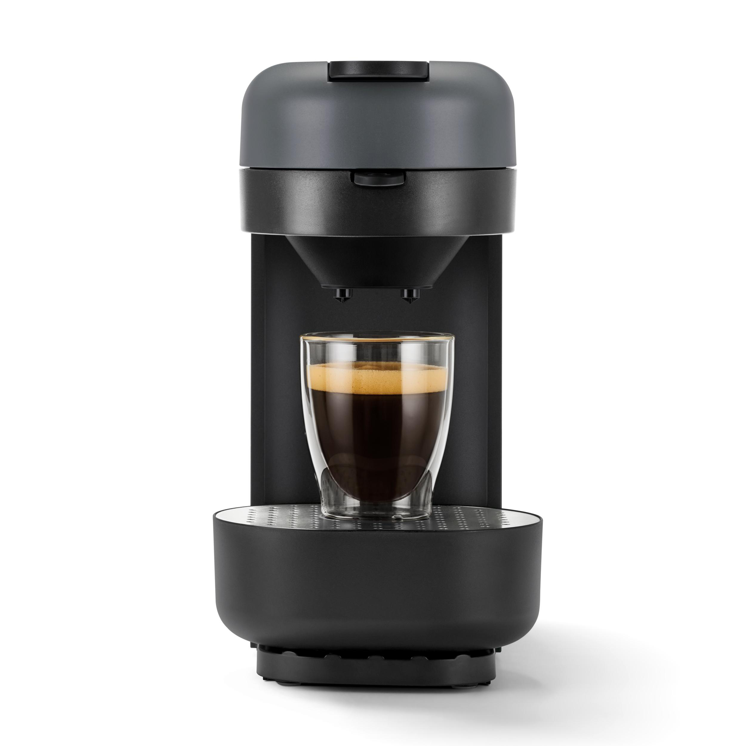 Espressomaschine mit Glasbecher. Schwarz-graues Design. Kaffee und Crema sichtbar.