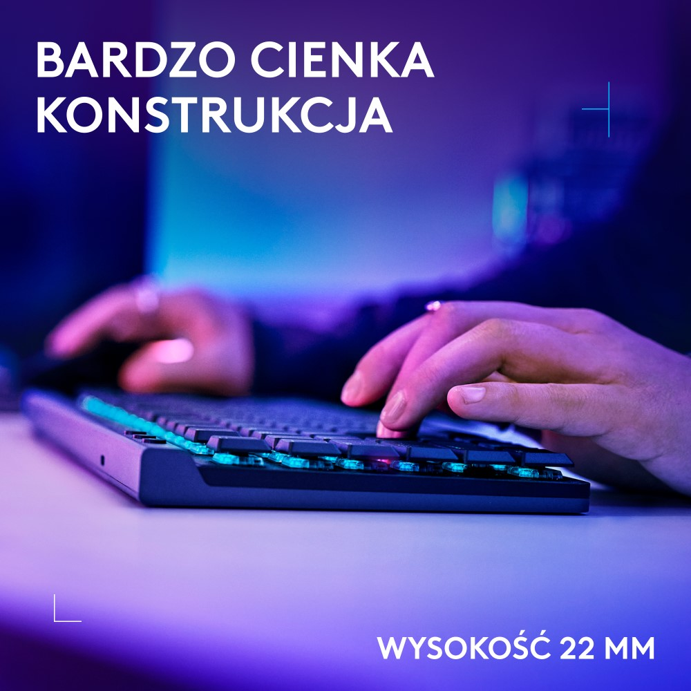 Dłonie na klawiaturze z niebieskim i zielonym światłem. Klawiatura jest niskoprofilowa i ergonomiczna.