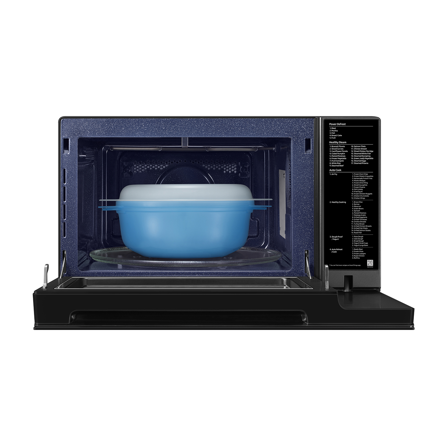 Interno del microonde con vaporiera blu e piatto in vetro.