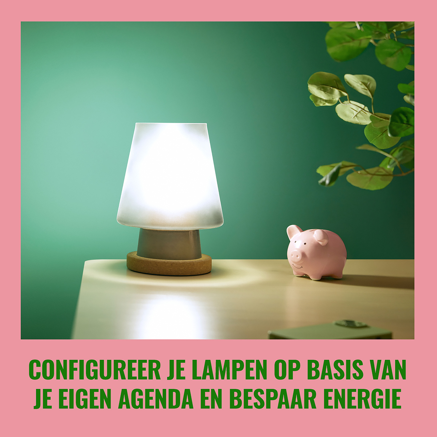 A white lamp on a table next to a pink piggy bank. Green background.
