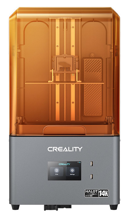 Drukarka 3D z pomarańczową, przezroczystą osłoną i szarą podstawą. Obecny jest mały wyświetlacz.