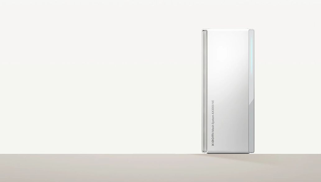 Fehér Xiaomi Mesh System AX3000 NE eszköz, világos felületen, fehér háttérrel.