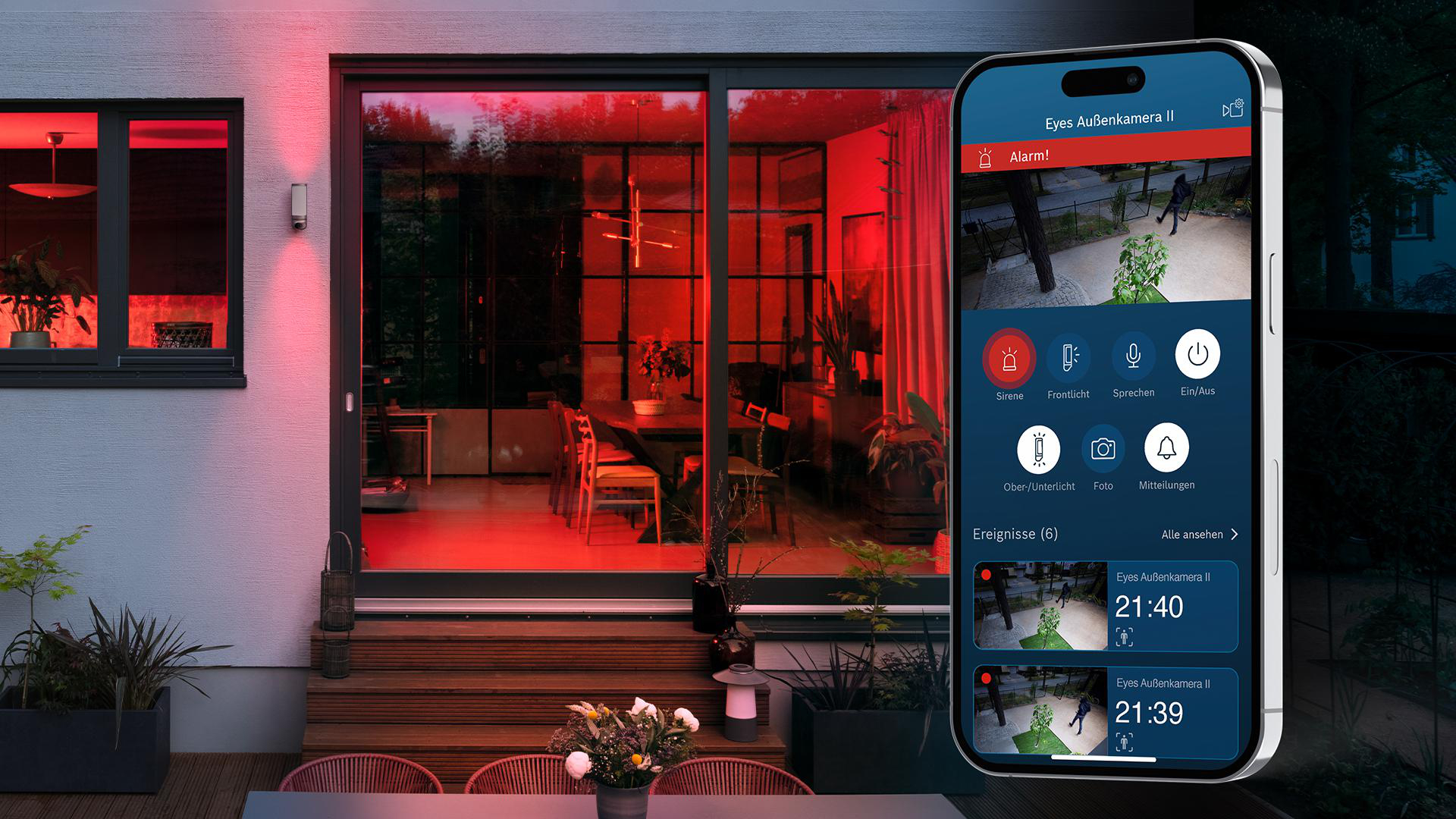 Smartphone zeigt Home Security App mit Haus in rotem Licht.