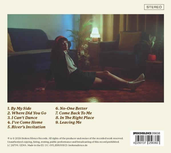 Albumcover mit Frau auf dem Boden, Songtitel gelistet.