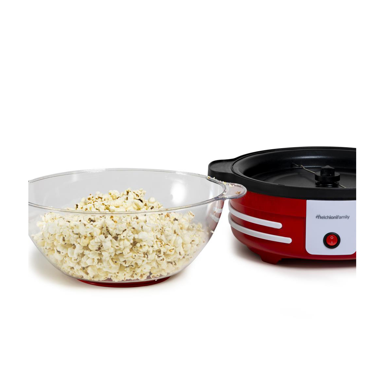 Macchina per popcorn e una ciotola di popcorn su sfondo bianco.