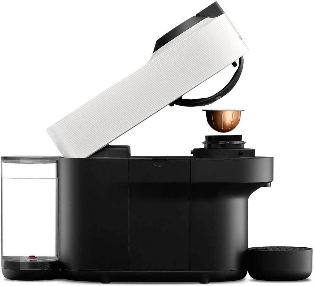 Black and white coffee machine, open, with a coffee pod being inserted.