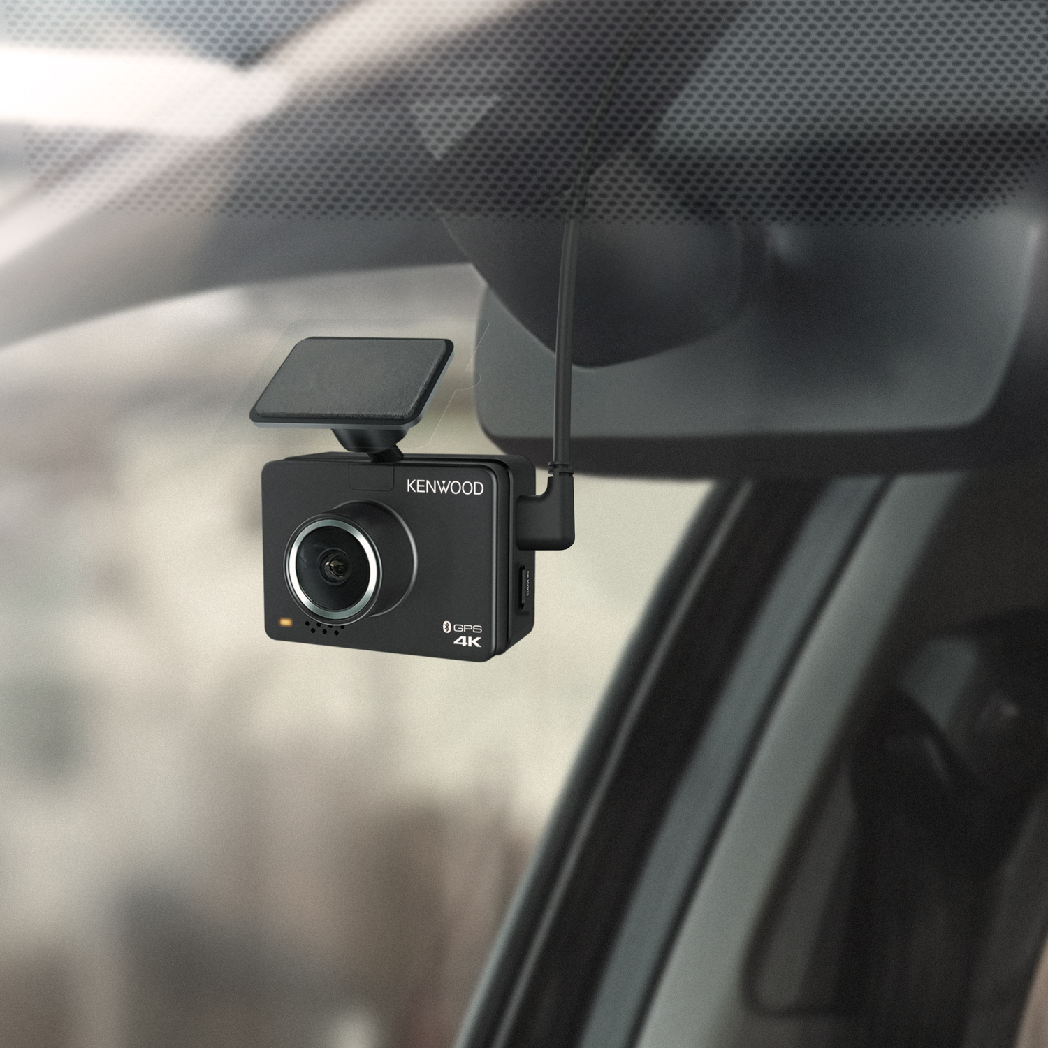 Kenwood dashcam attached to windshield, inside of car.
