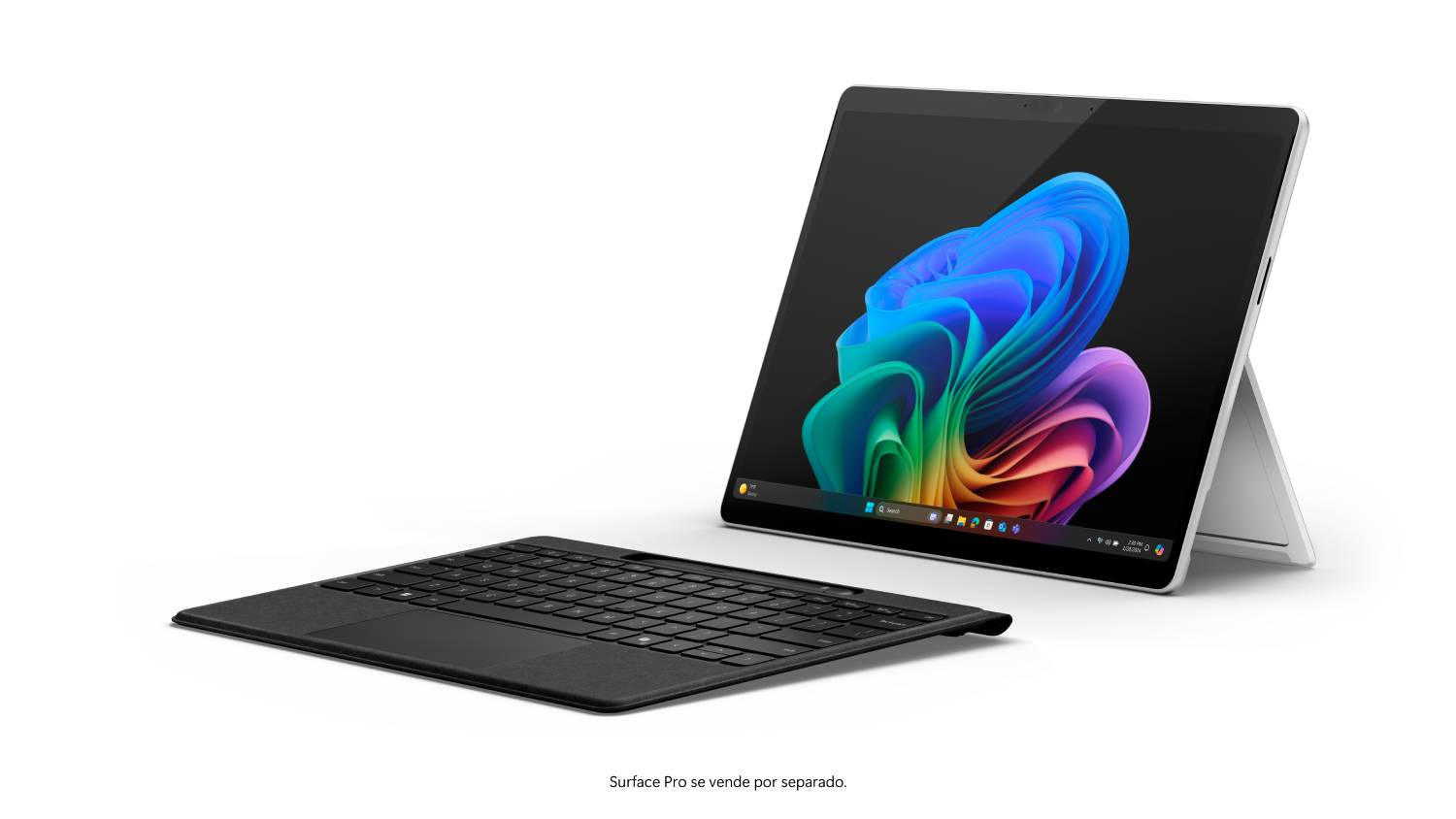 Una tableta Surface Pro con teclado. La tableta está abierta, mostrando un fondo colorido. El teclado es negro.