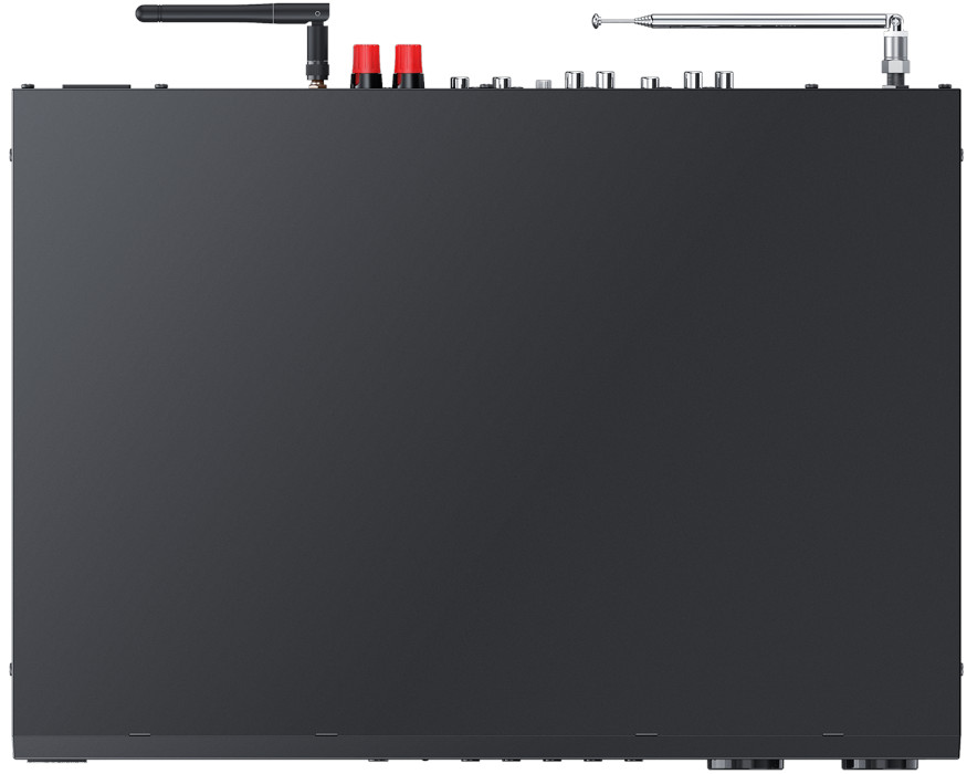 Back view of a black electronic device, with antennas and connectors on top.