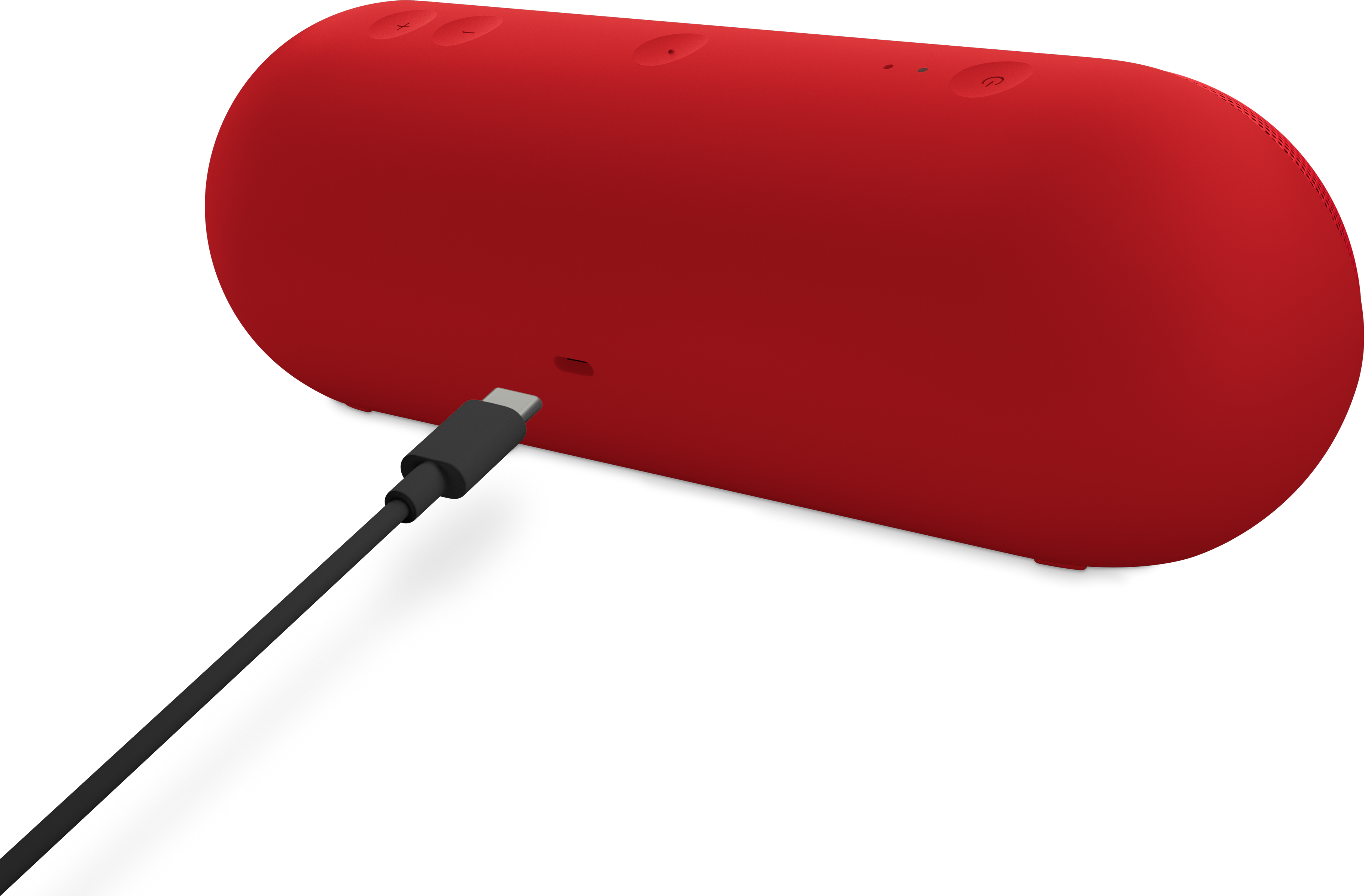 Haut-parleur rouge sur fond noir avec câble noir attaché, port USB-C visible.