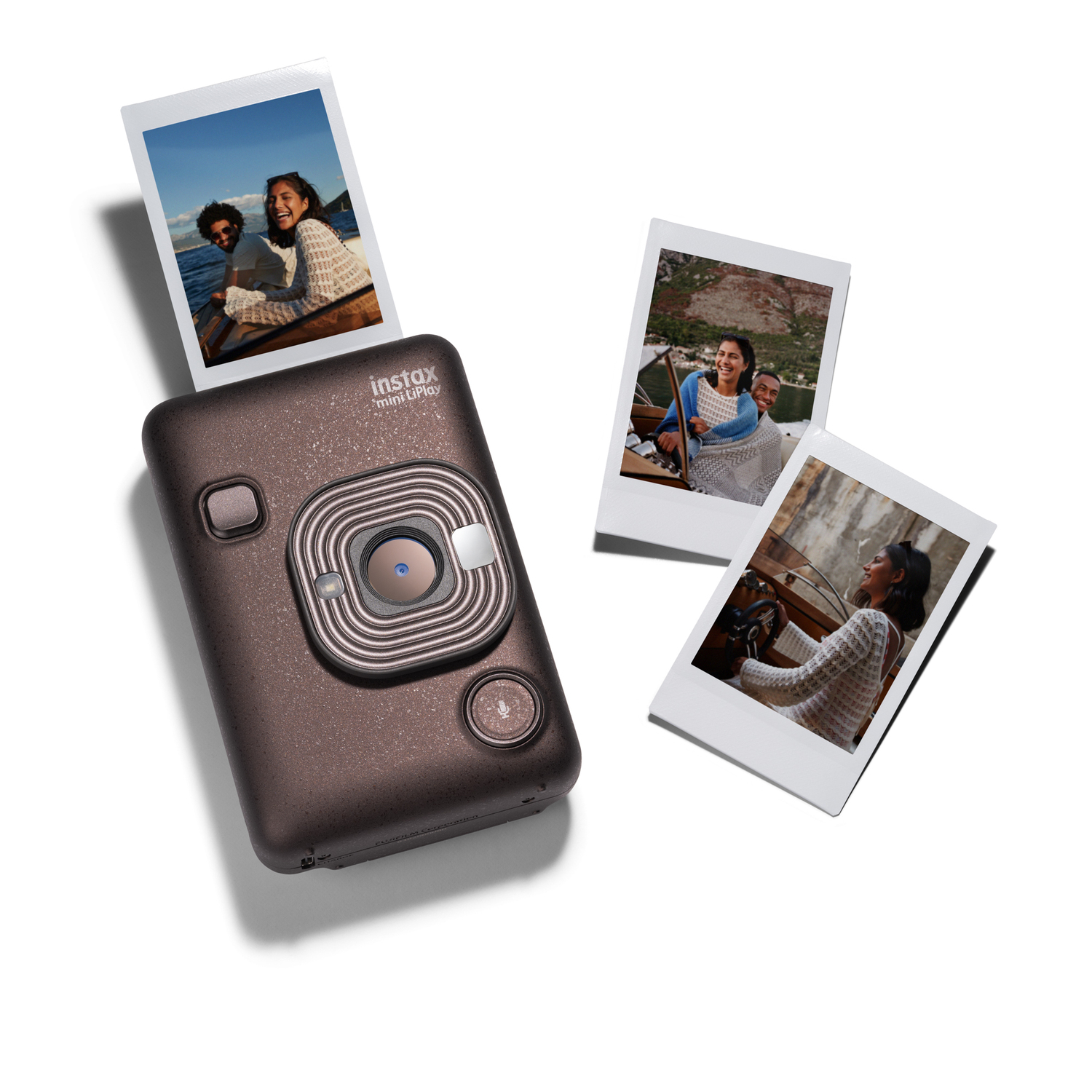A brown Instax camera with three photos. People are smiling on the photos.