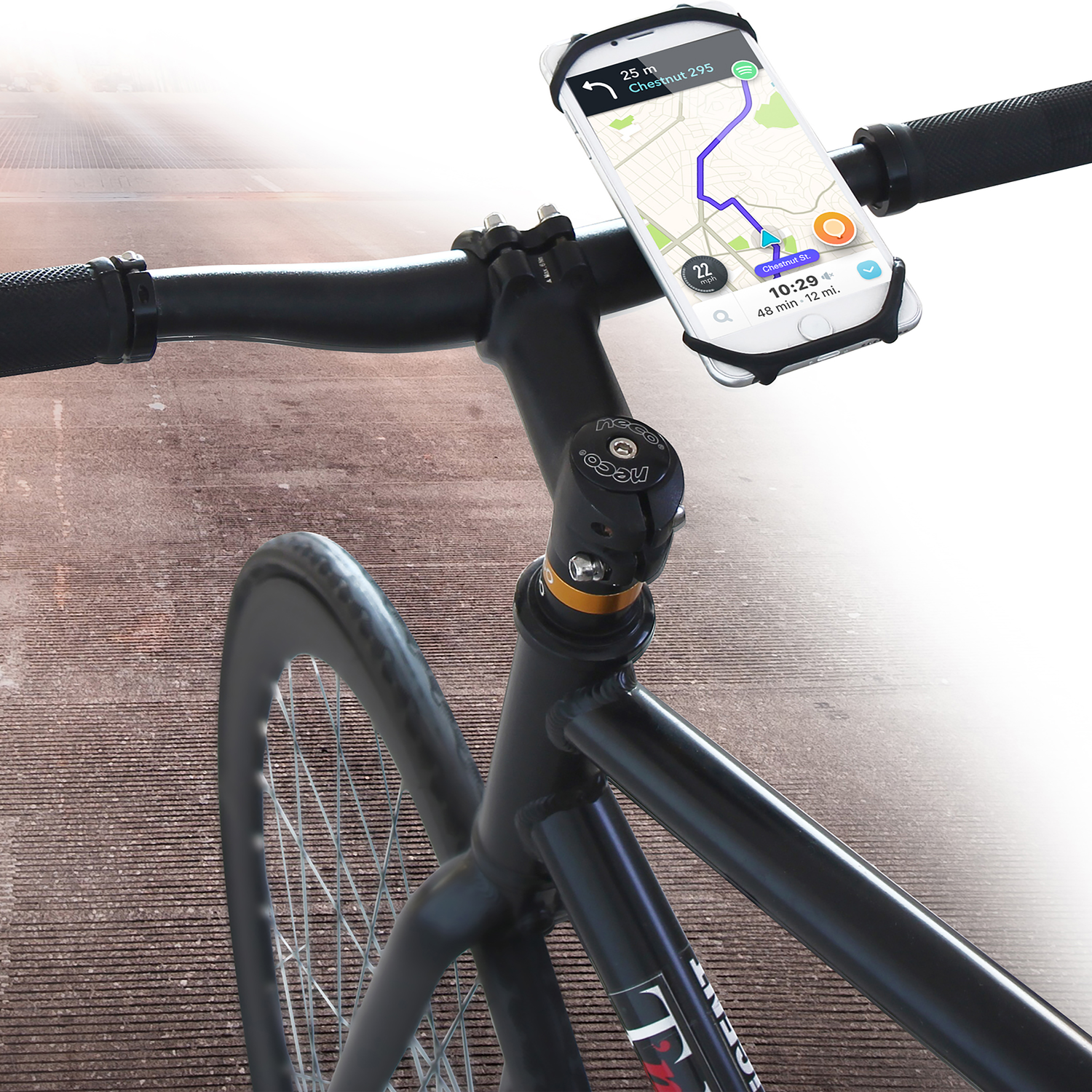 Bike handlebar with phone mount displaying a map. The bike is black.