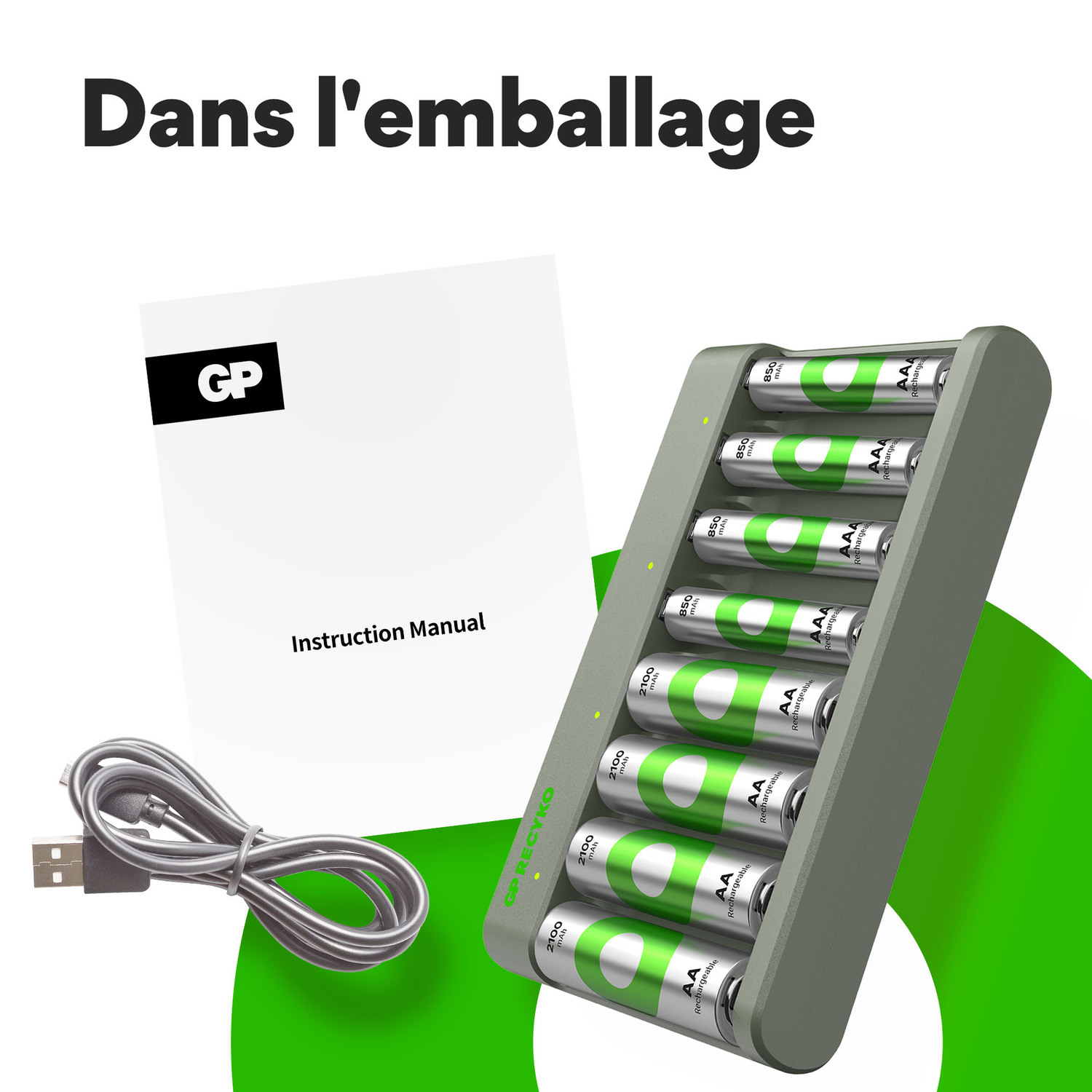 Un chargeur de batterie, un manuel d'instructions et un câble USB sur une surface verte.
