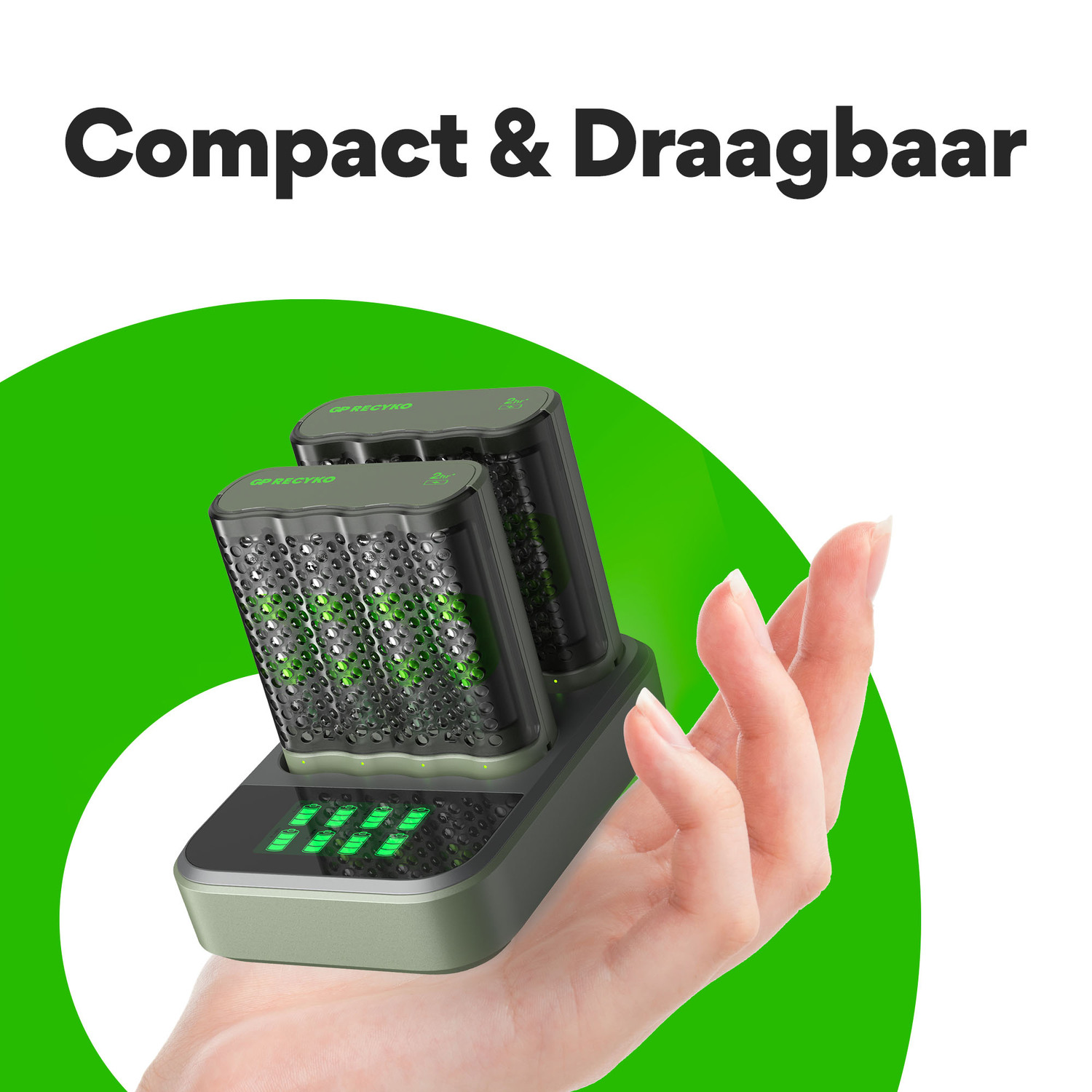 A hand holding a charging station with two battery packs. The station has green lights.