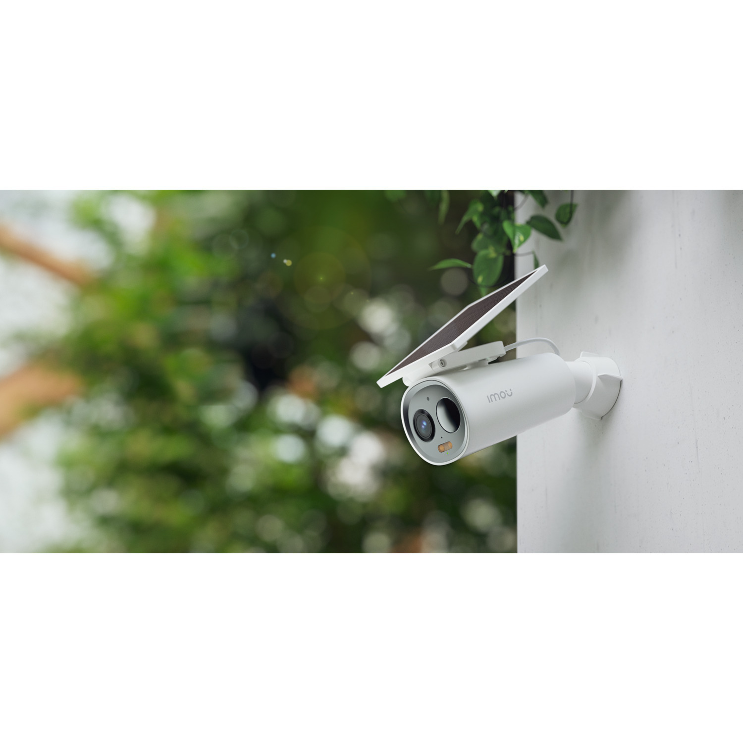 A white security camera mounted on a wall with a solar panel.