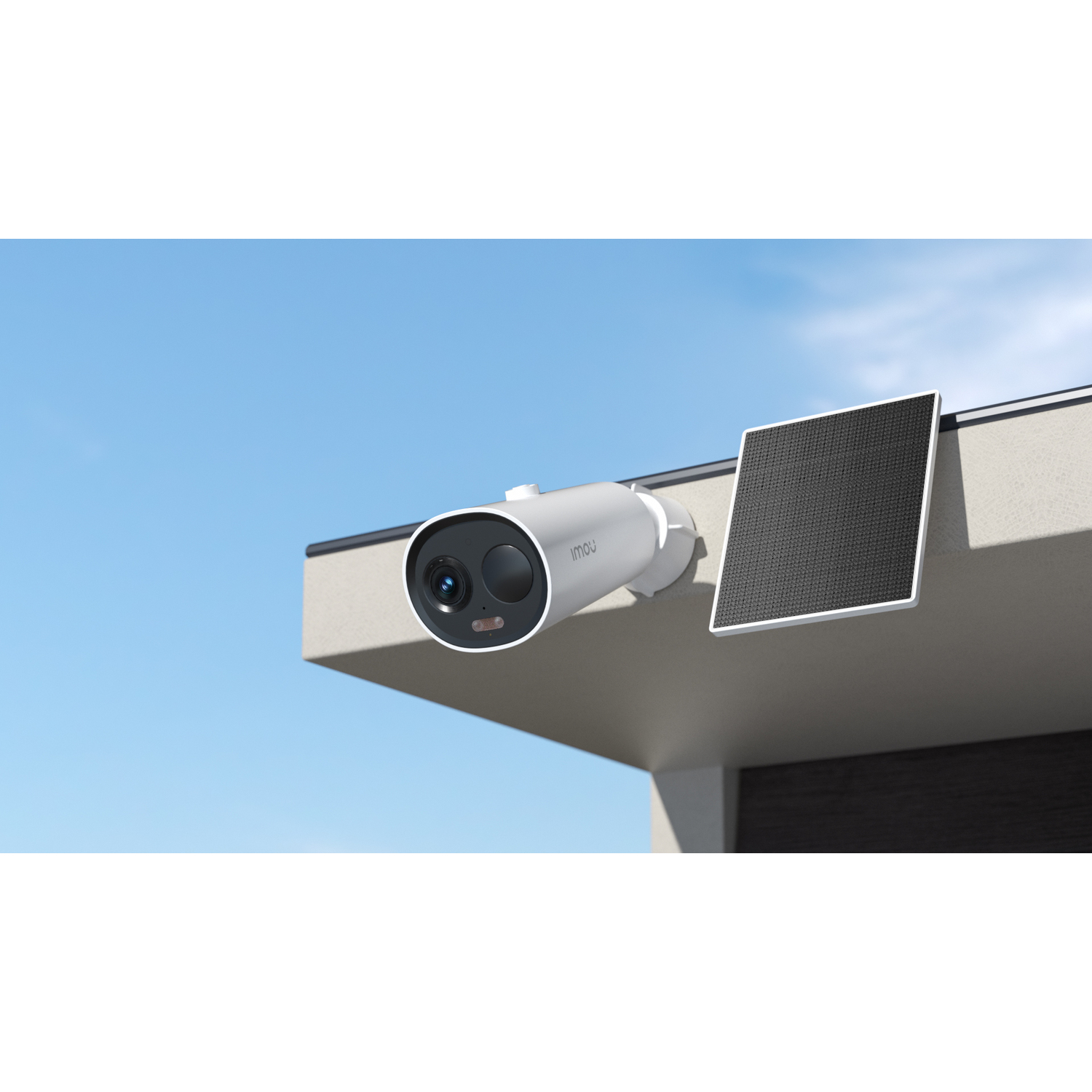 White security camera with a solar panel on a building's edge, blue sky.