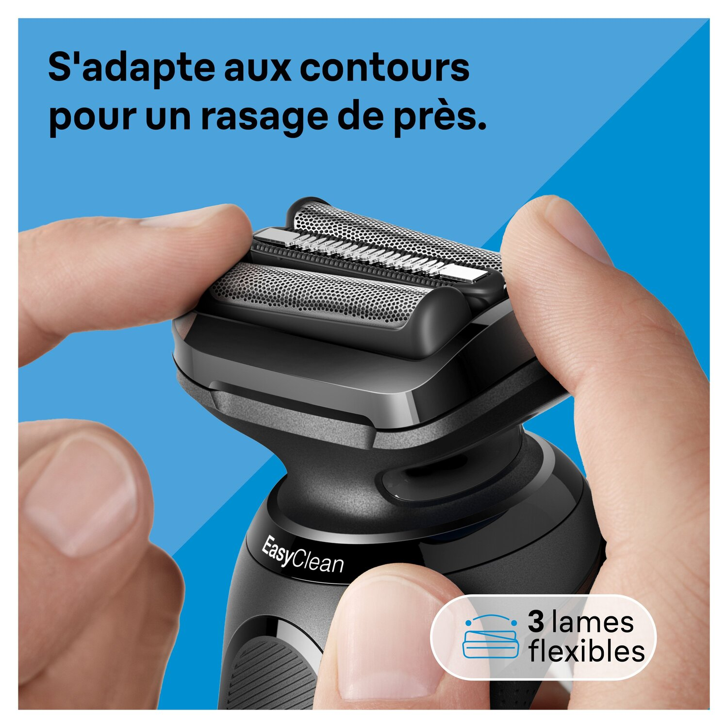 Un homme tient un rasoir électrique. Le rasoir a trois lames flexibles.