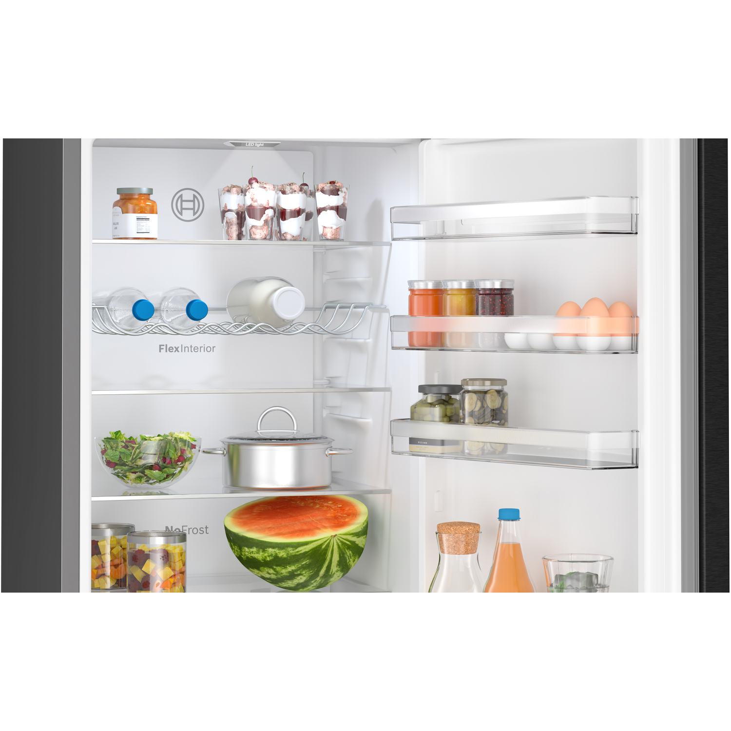 Refrigerator interior, with food and water bottles.