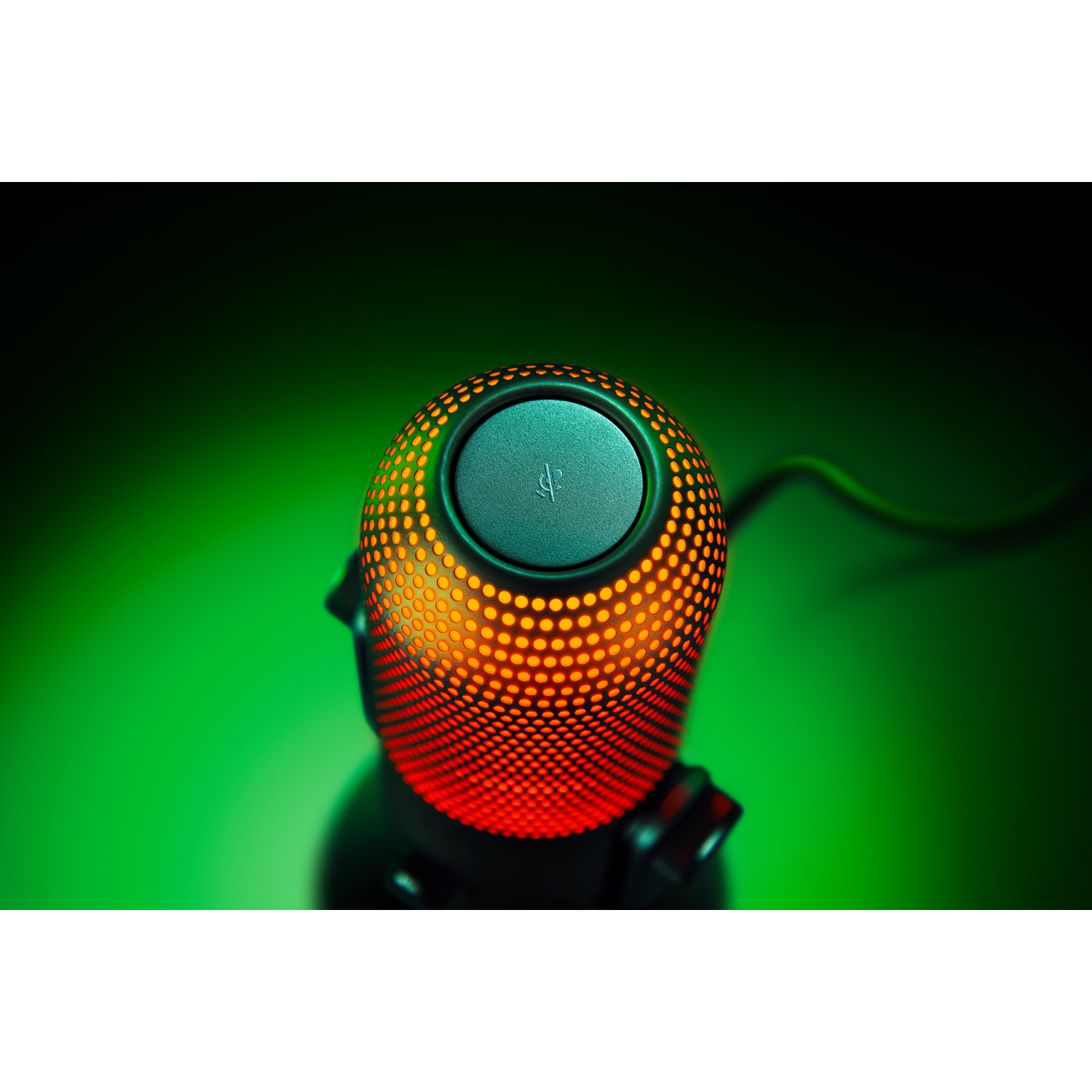 Microphone with red and orange lights. The background is a gradient of green and black.