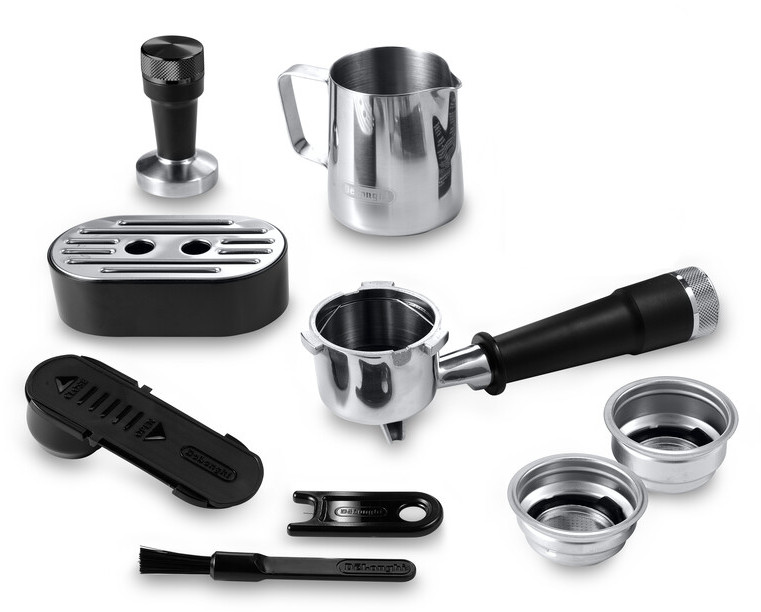 Various components of an espresso machine laid out on a white surface.