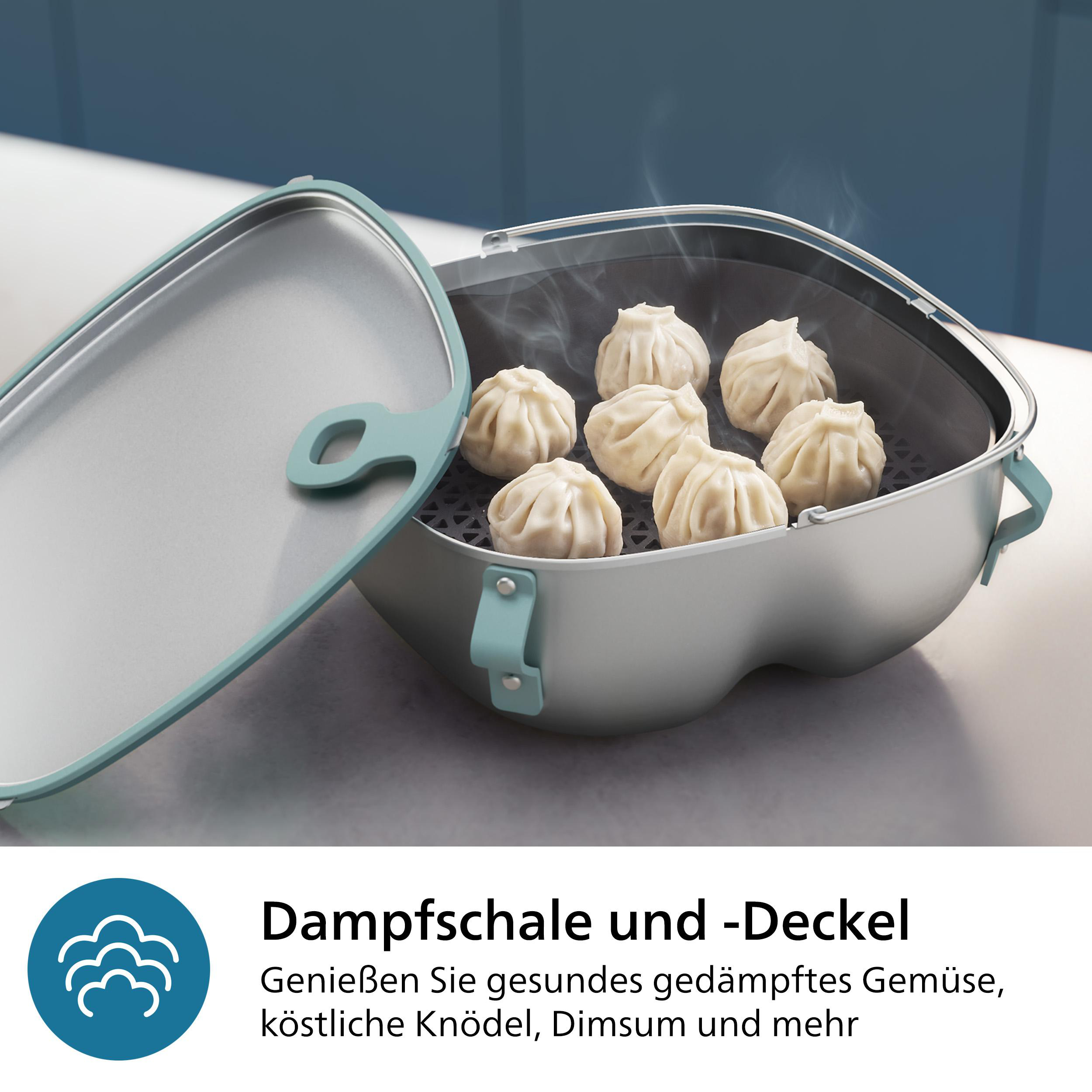 Dampfgarer mit Knödeln. Blauer und silberner Behälter mit Text darunter.