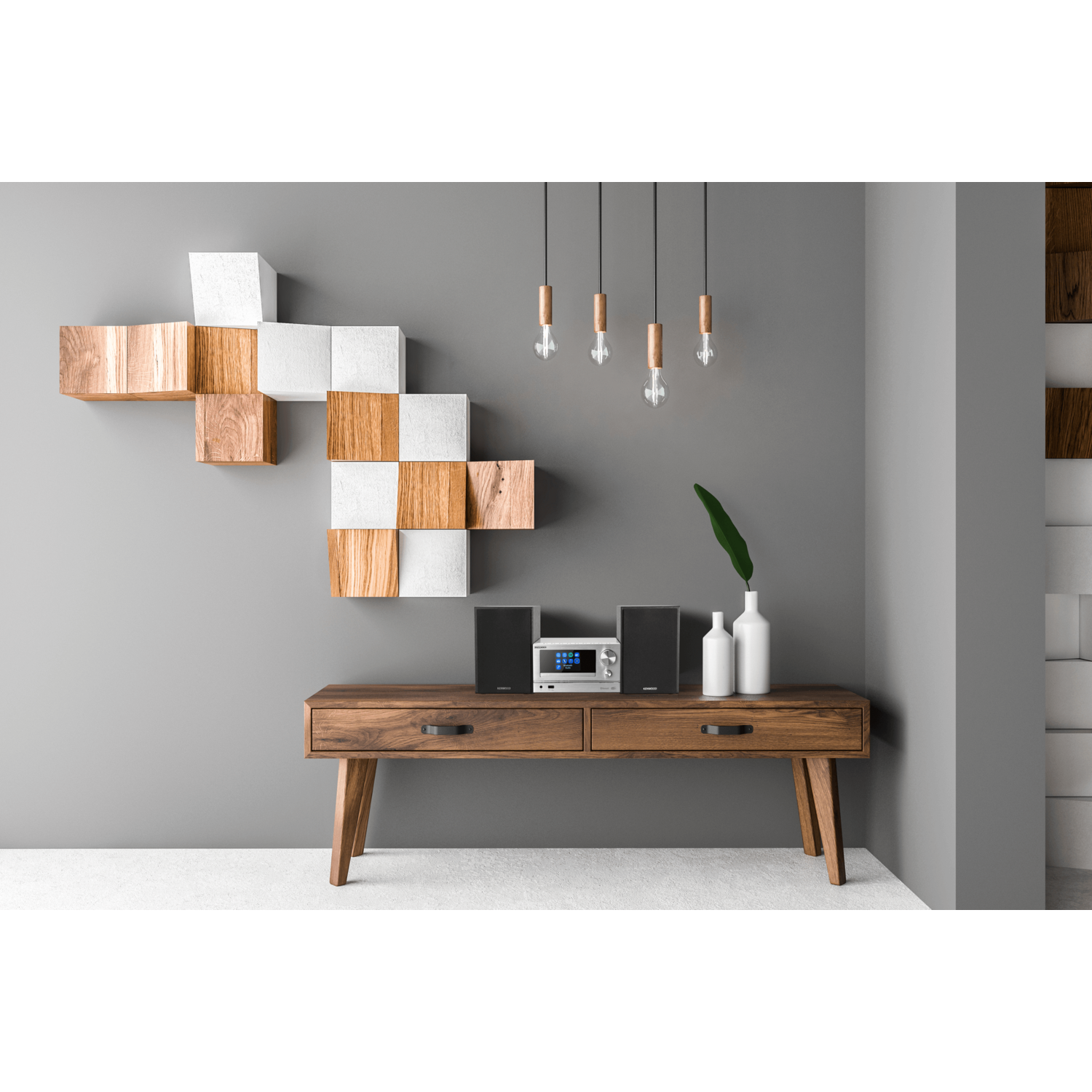 Houten kast met decoratieve items. Drie hanglampen. Witte muur, witte vloer.