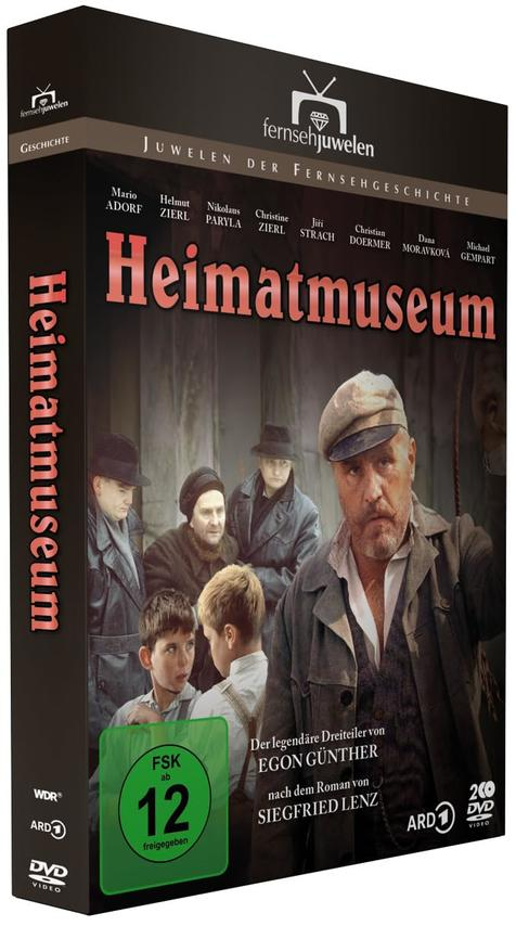 DVD-Box der deutschen Fernsehsendung 'Heimatmuseum' mit Schauspielern und Titel.