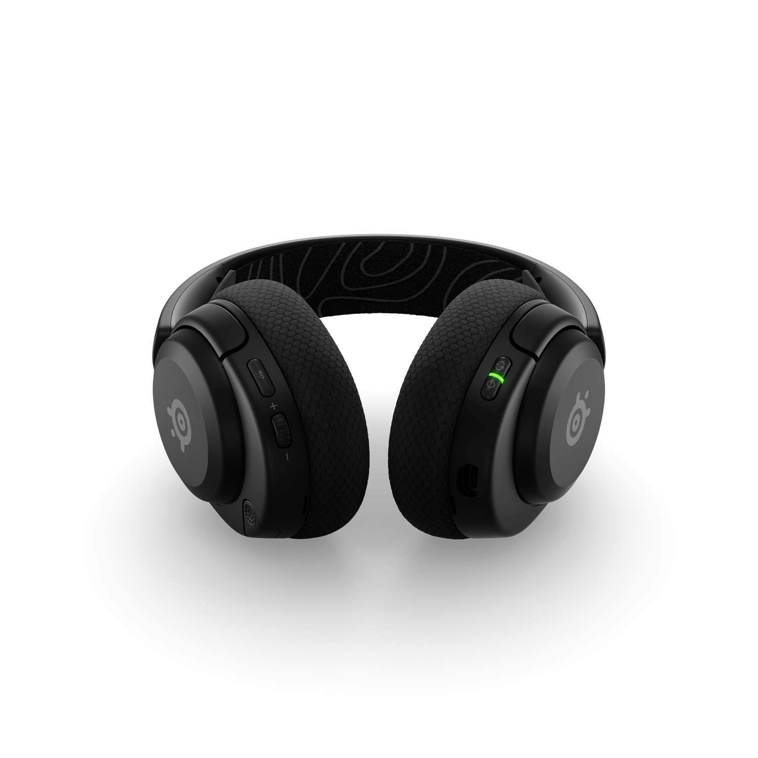 Auriculares negros sobre un fondo negro.