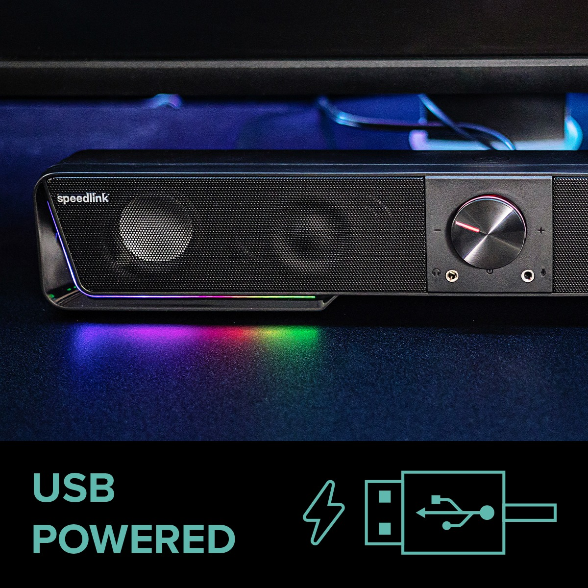 Schwarze Soundbar mit Mesh, Lautstärkeregler und LED-Leuchten, vor dunklem Hintergrund.
