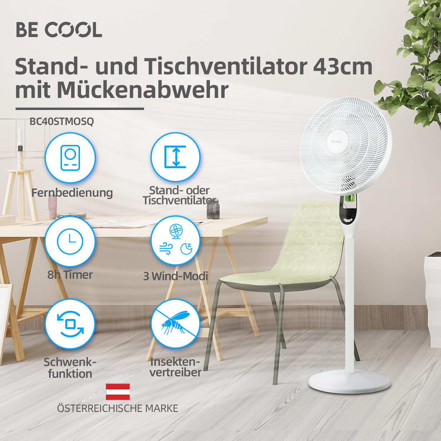 Weißer Standventilator mit Insektenschutzfunktion. Der Ventilator hat einen grünen Stuhl und Schreibtisch.