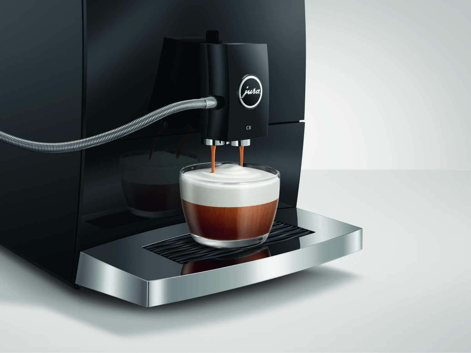 Máquina de espresso dispensando café en un vaso.
