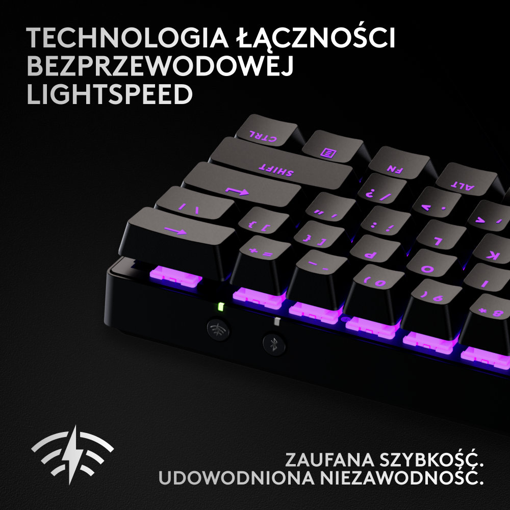 Zbliżenie czarnej klawiatury z fioletowymi klawiszami. Tekst: 'TECHNOLOGIA ŁĄCZNOŚCI BEZPRZEWODOWEJ LIGHTSPEED'.