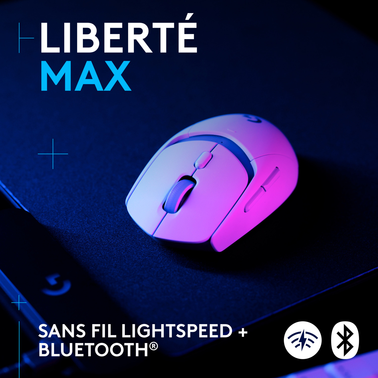 Une souris sans fil blanche sur une surface noire avec le texte "LIBERTÉ MAX" et "SANS FIL LIGHTSPEED + BLUETOOTH".